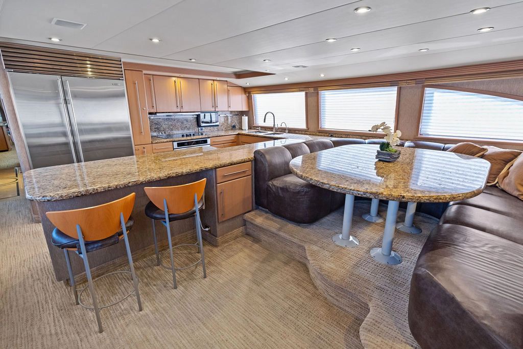 Luxurious kitchen and dining area in a 1999 Westport 112 yacht.