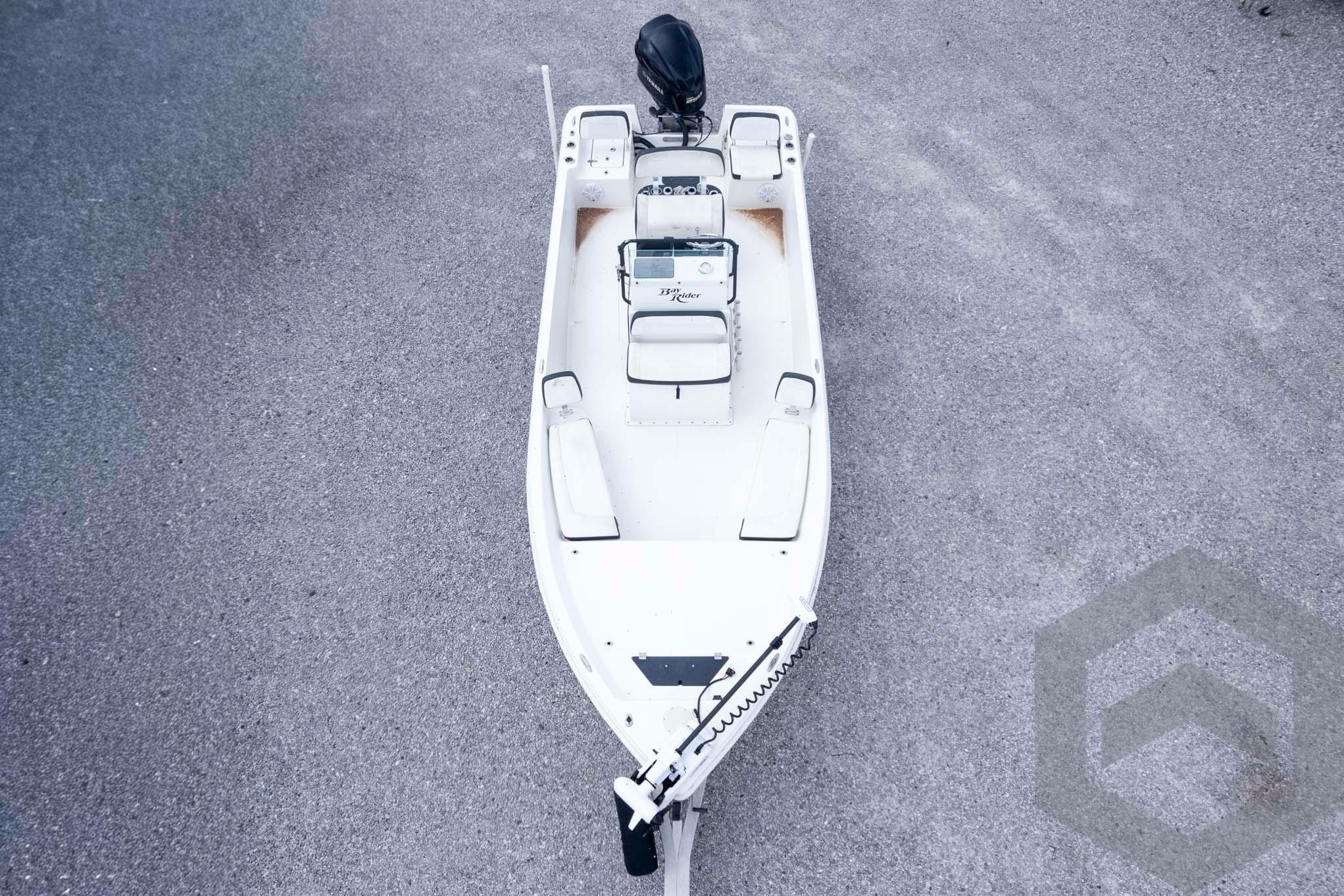 2018 Bay Rider 238 Bay boat, aerial view, parked on gravel surface.