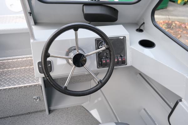 2024 Hewescraft 180 Pro-V ET boat interior with steering wheel and control panel.