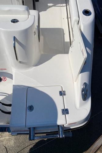 2024 Robalo R222 Center Console boat deck with storage compartments and stainless steel hardware.