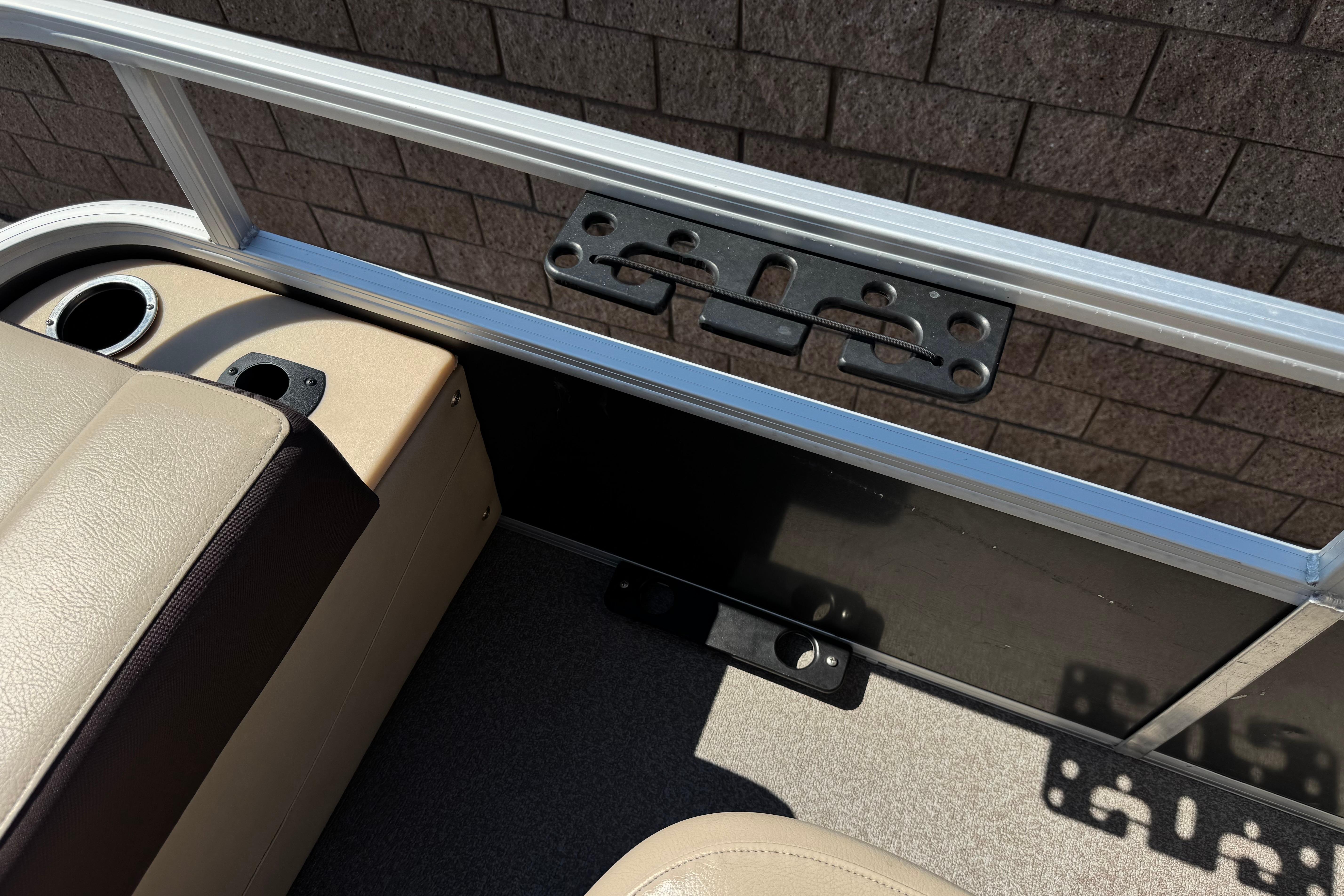 Interior of 2018 Sun Tracker SportFish 22 DLX boat with seating and cup holder.