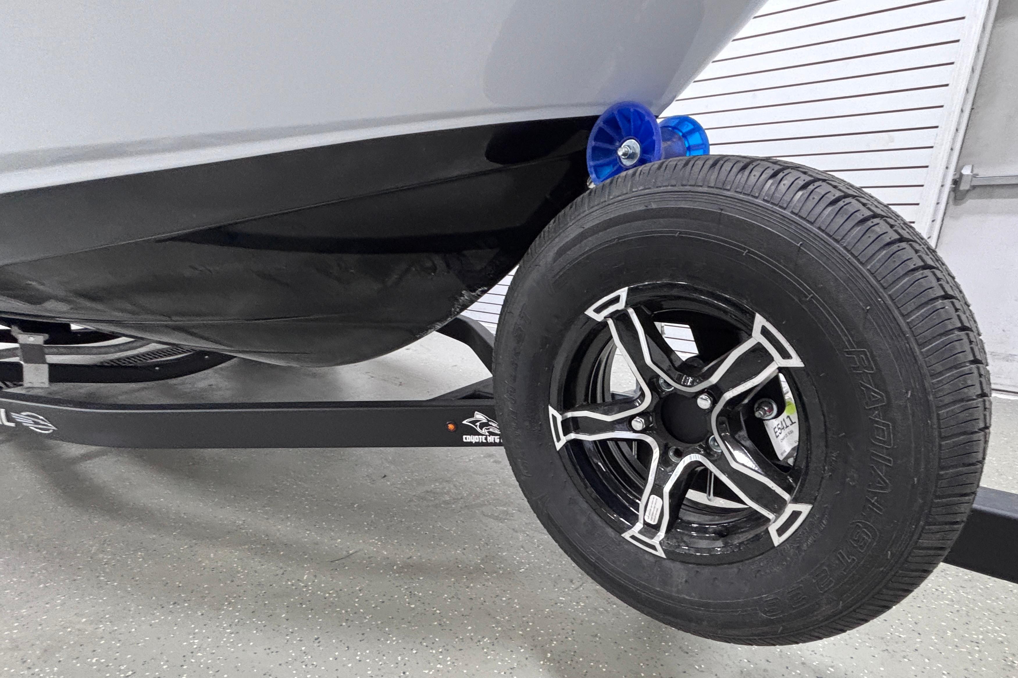 2026 Chaparral 21 SSi boat trailer with black tire and sleek design.