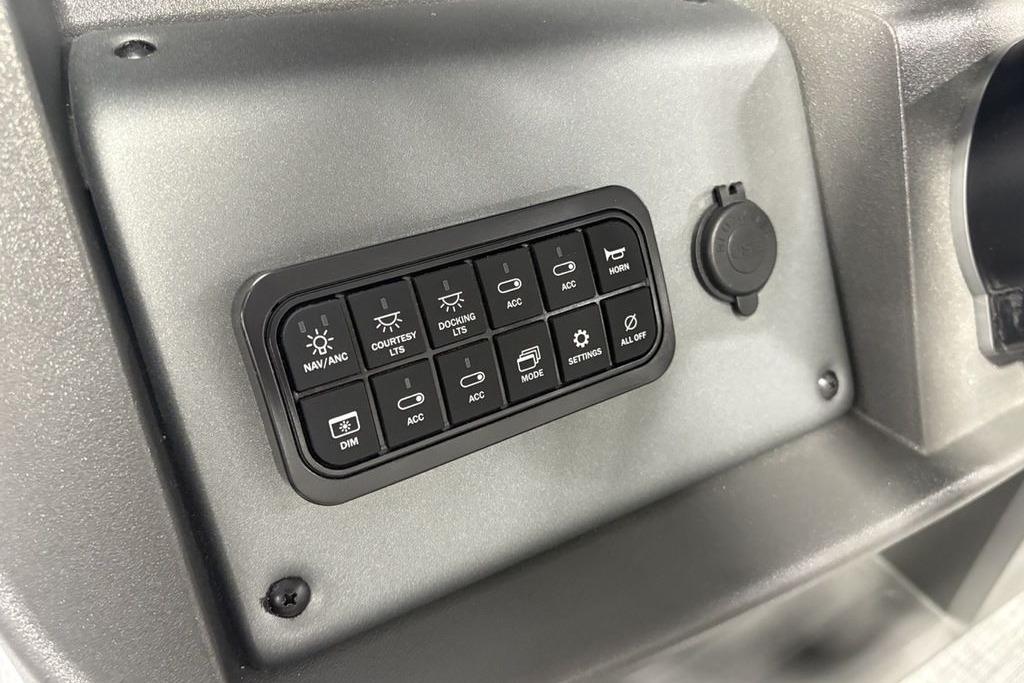 Control panel of 2026 Sun Tracker PARTY BARGE® 20 DLX with various function buttons.