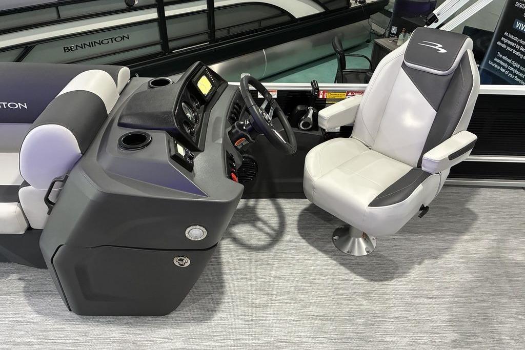 2026 Bennington S Quad Bench 22 SSR boat interior with helm and captain's chair.