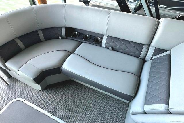 Luxurious seating on 2021 Bennington L Bowrider 25 Quad Bench with cup holders and quilted design.