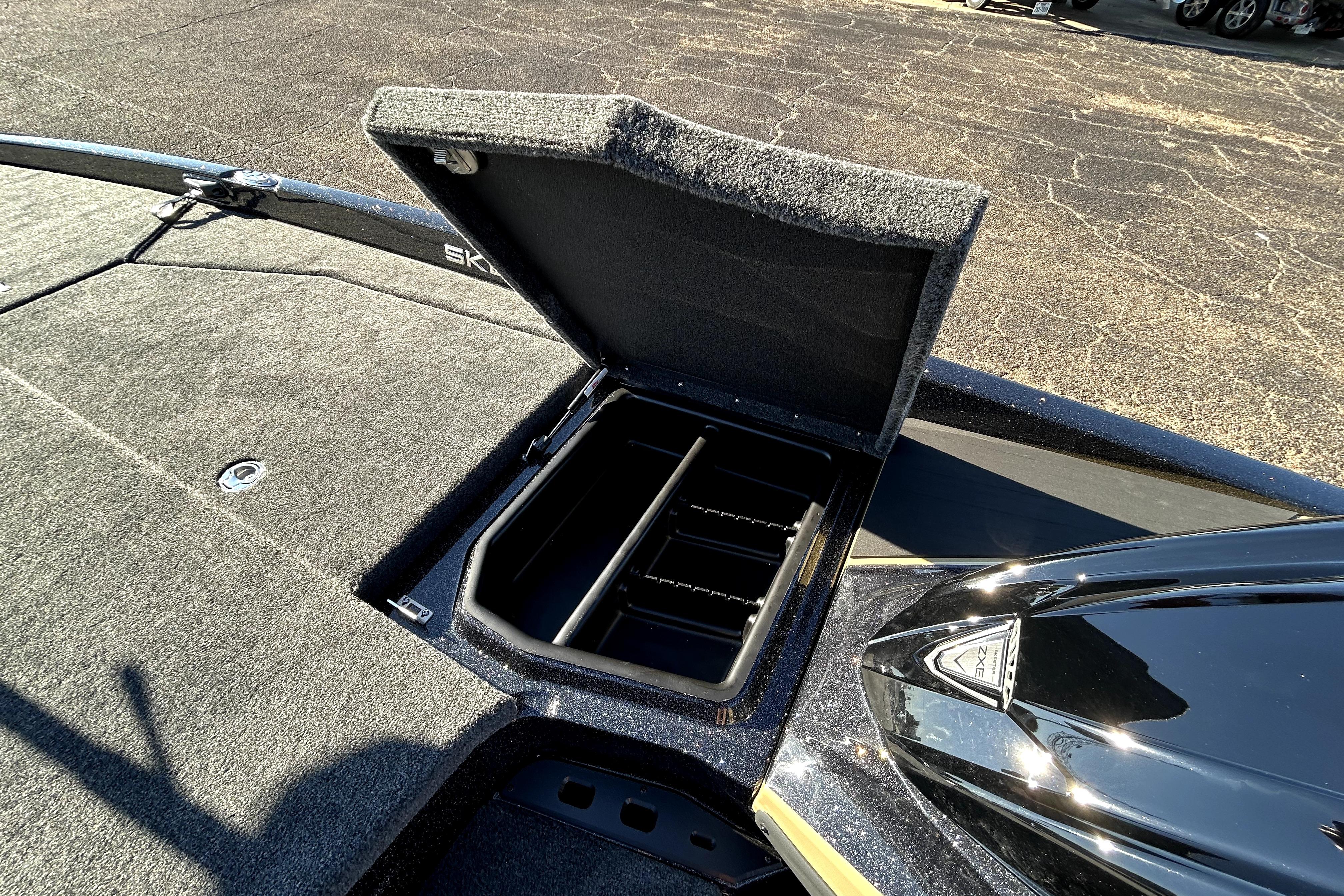 Open storage compartment on 2026 Skeeter ZXE21 boat deck.