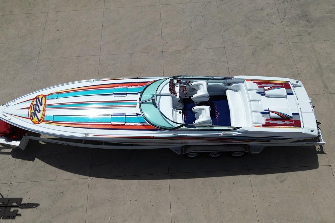 2002 Formula 382 FASTech speedboat with colorful stripes, viewed from above on a trailer.