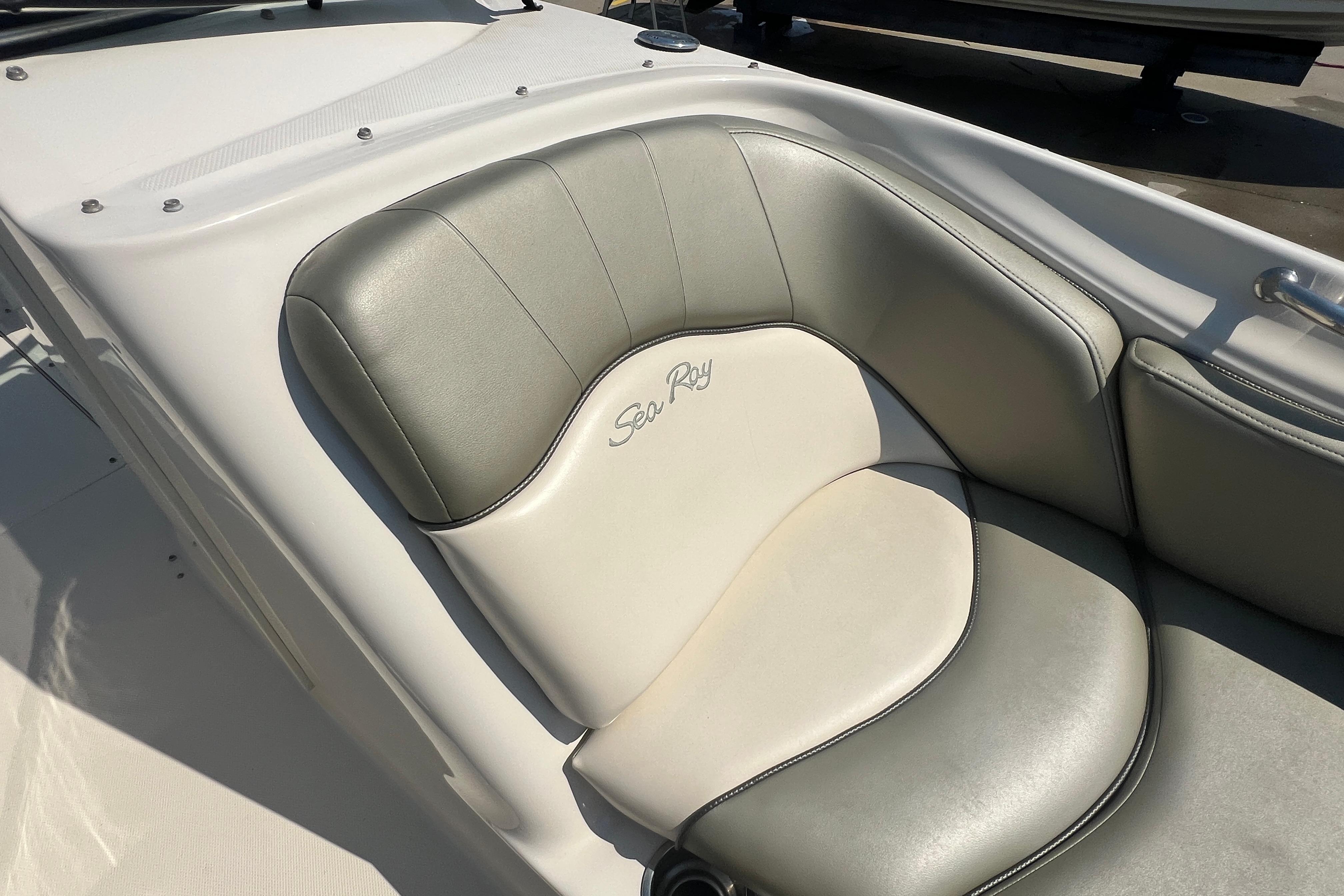 2005 Sea Ray 240 Sundeck boat seat with elegant gray and white upholstery.