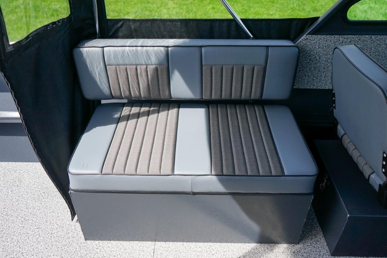 2026 Alumaweld X202 Styker boat interior with gray cushioned seating.