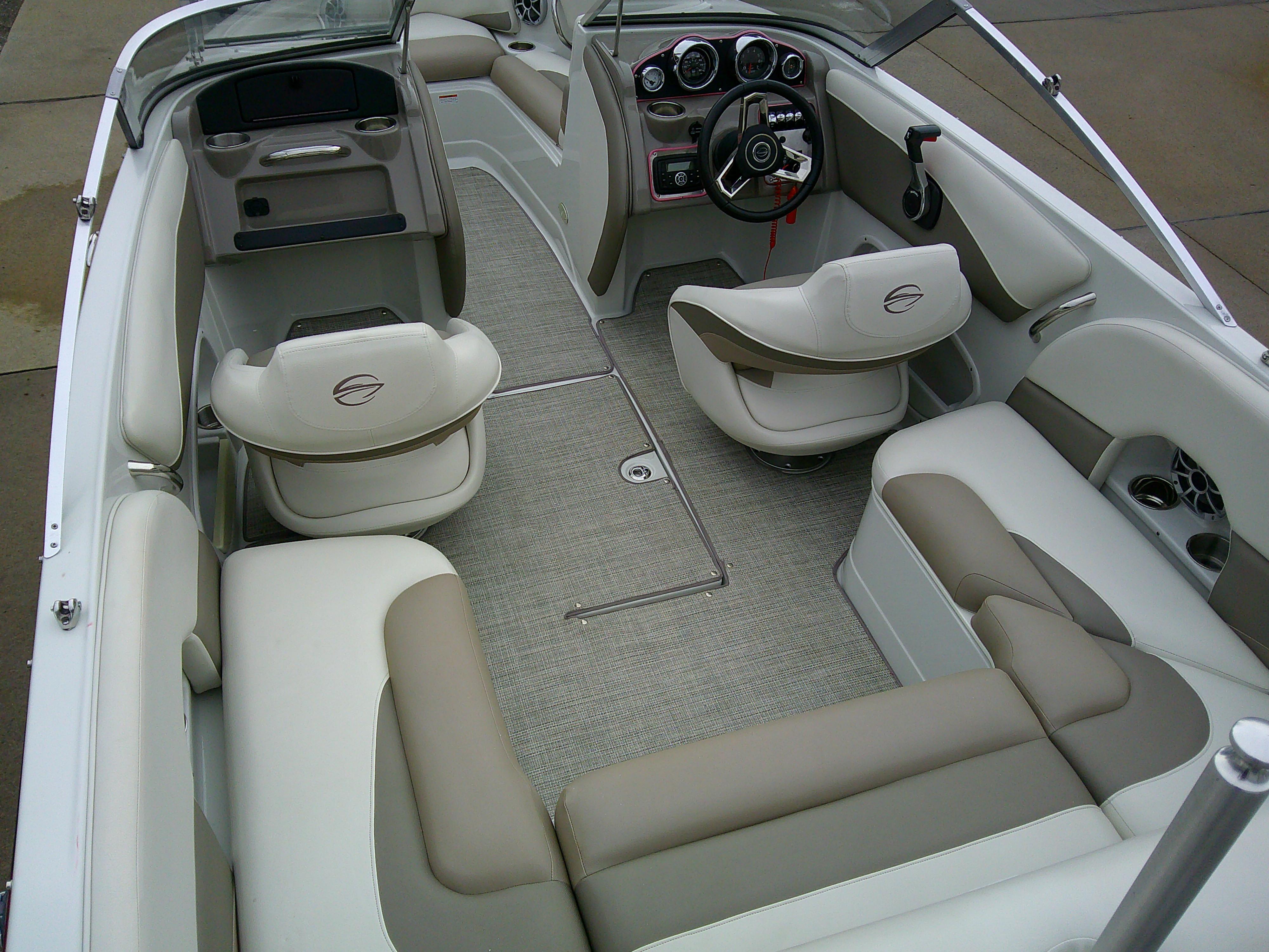 2019 Crownline 19 XS boat interior with beige seating and modern dashboard.
