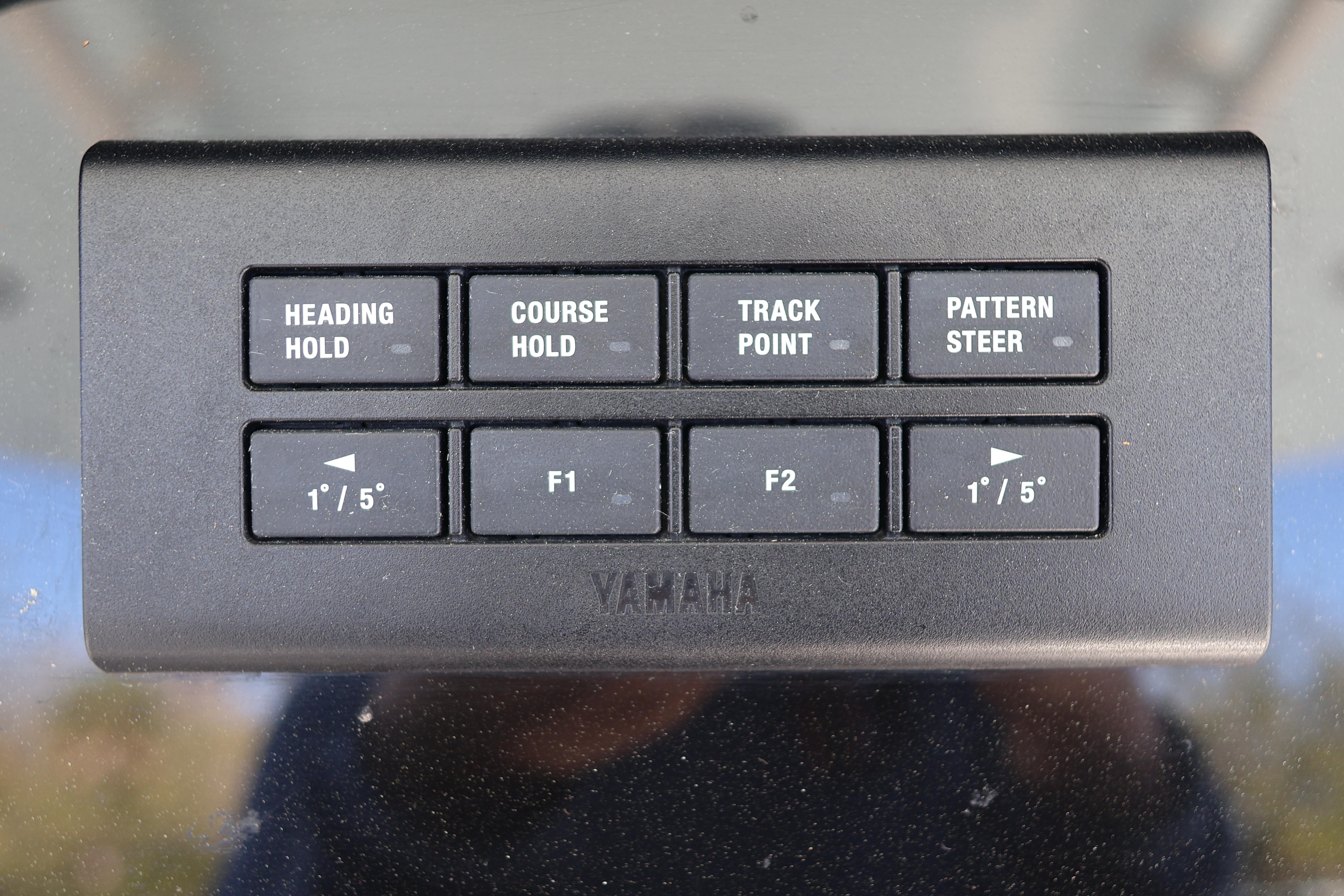 Control panel of a 2022 World Cat 280 CC-X boat with navigation buttons.
