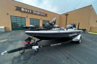 2026 Ranger Z518 Cup-Equipped boat parked outside a boat service center.
