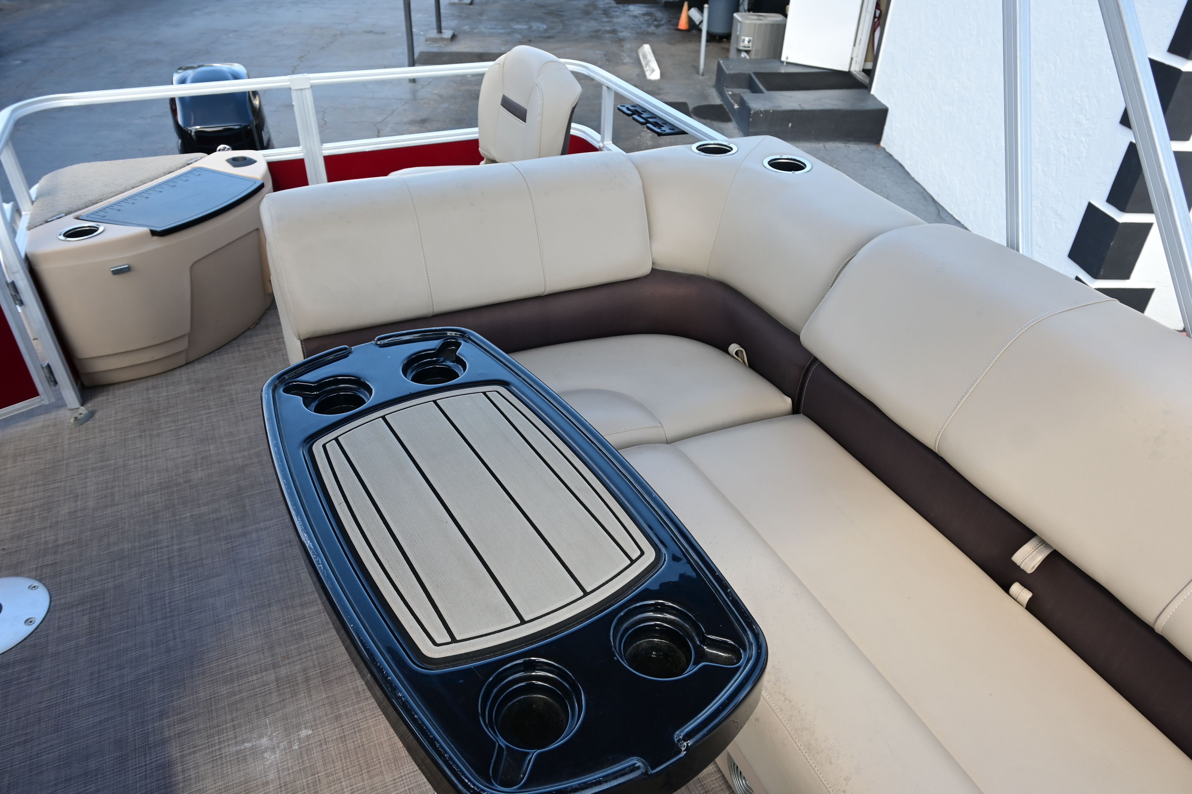 Interior of a 2019 Sun Tracker FISHI pontoon boat with seating area.