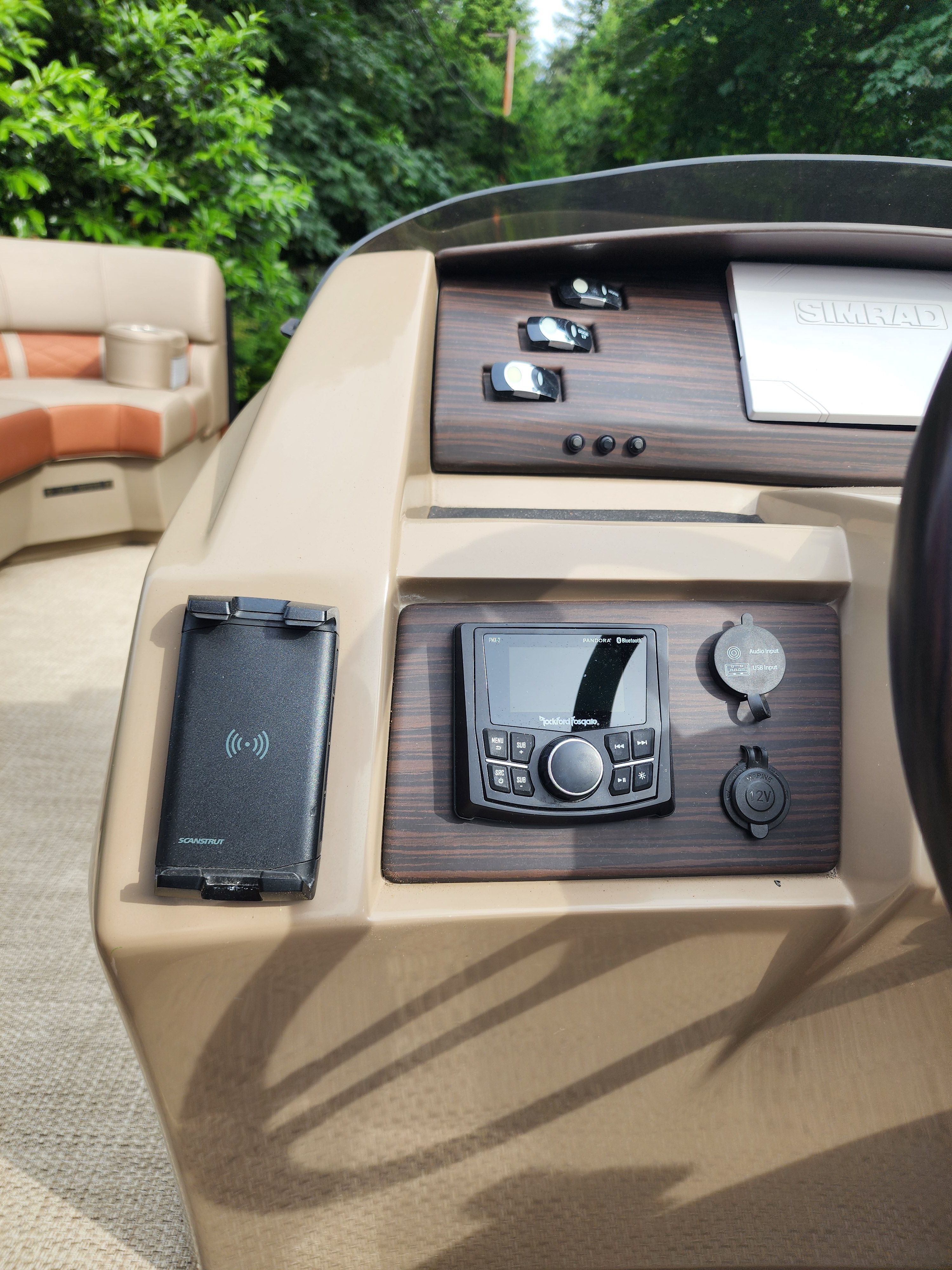 The image shows the dashboard of a Bennington 22 LSB boat with modern controls.