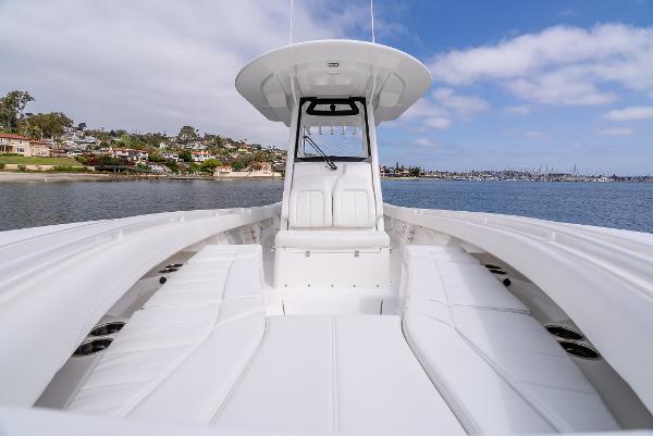 Regulator 28 boat 2025 on calm water with blue sky.