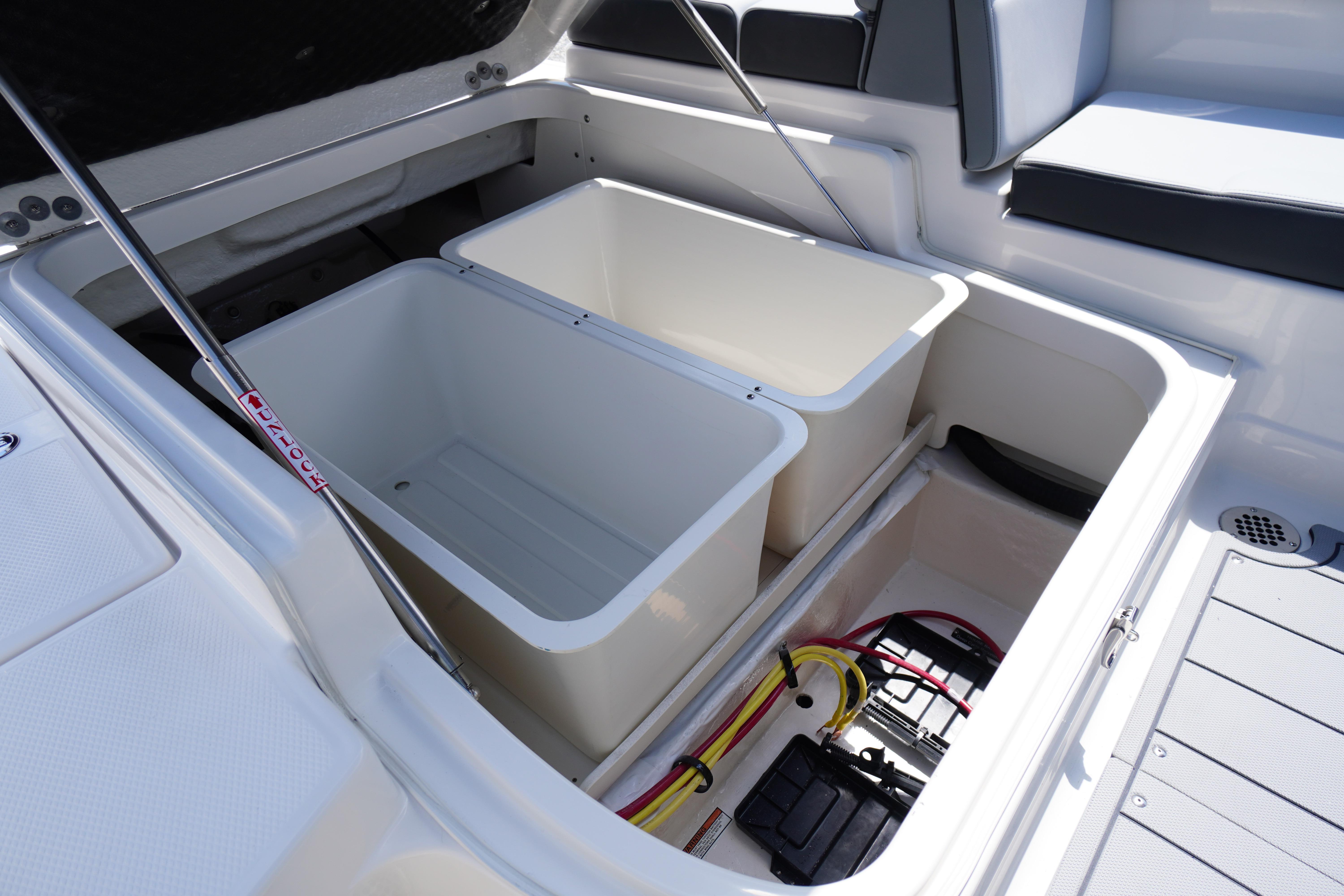2026 Chaparral SSX 4 boat storage compartments with open lids and visible wiring.