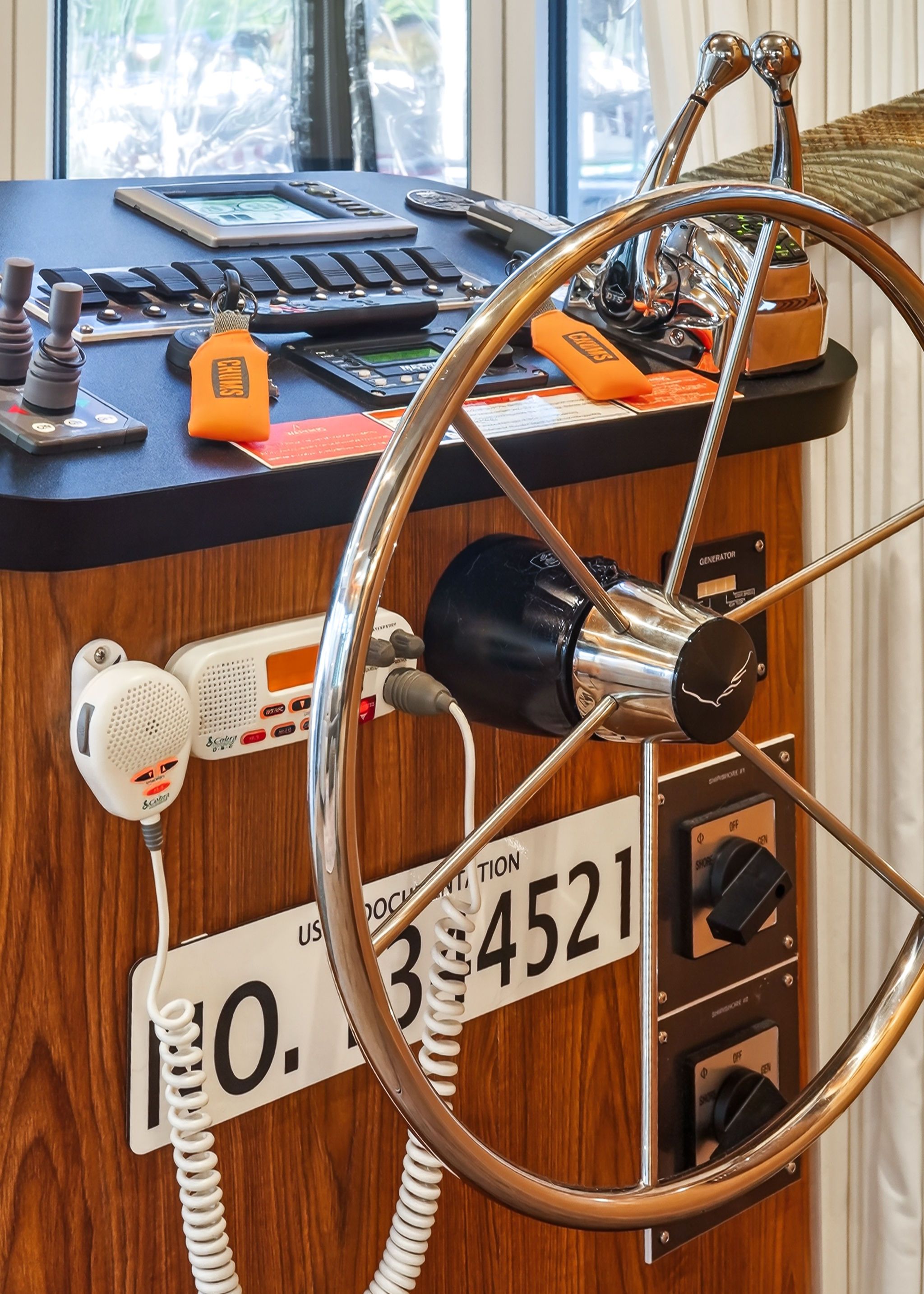 2010 Houseboat Throughbred helm with steering wheel and controls.