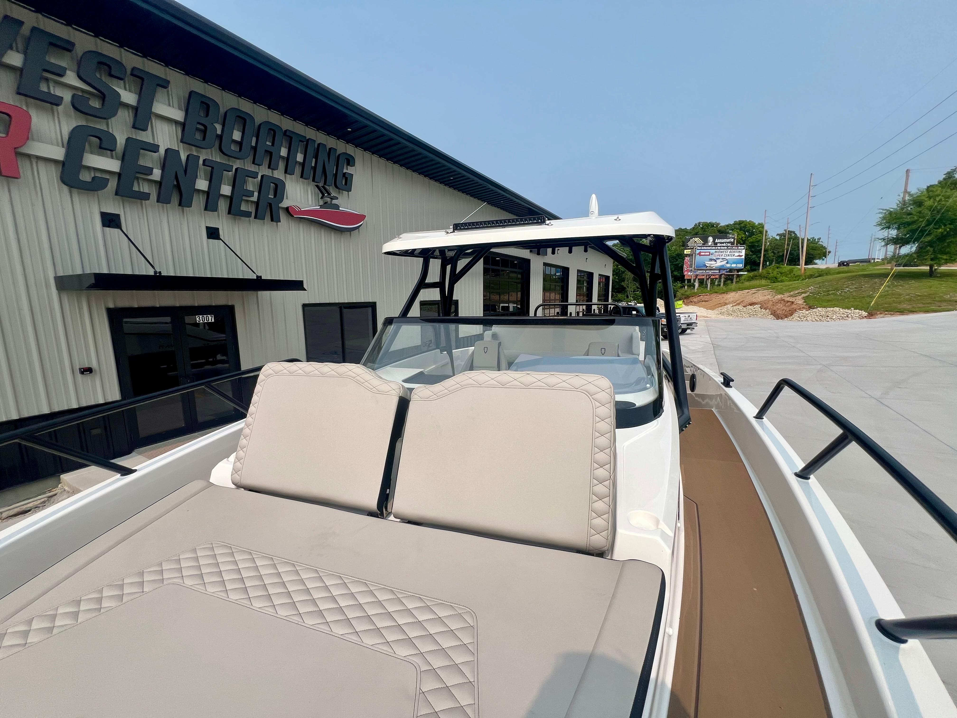 2025 Navan S-30 boat at dealership, featuring sleek design and comfortable seating.