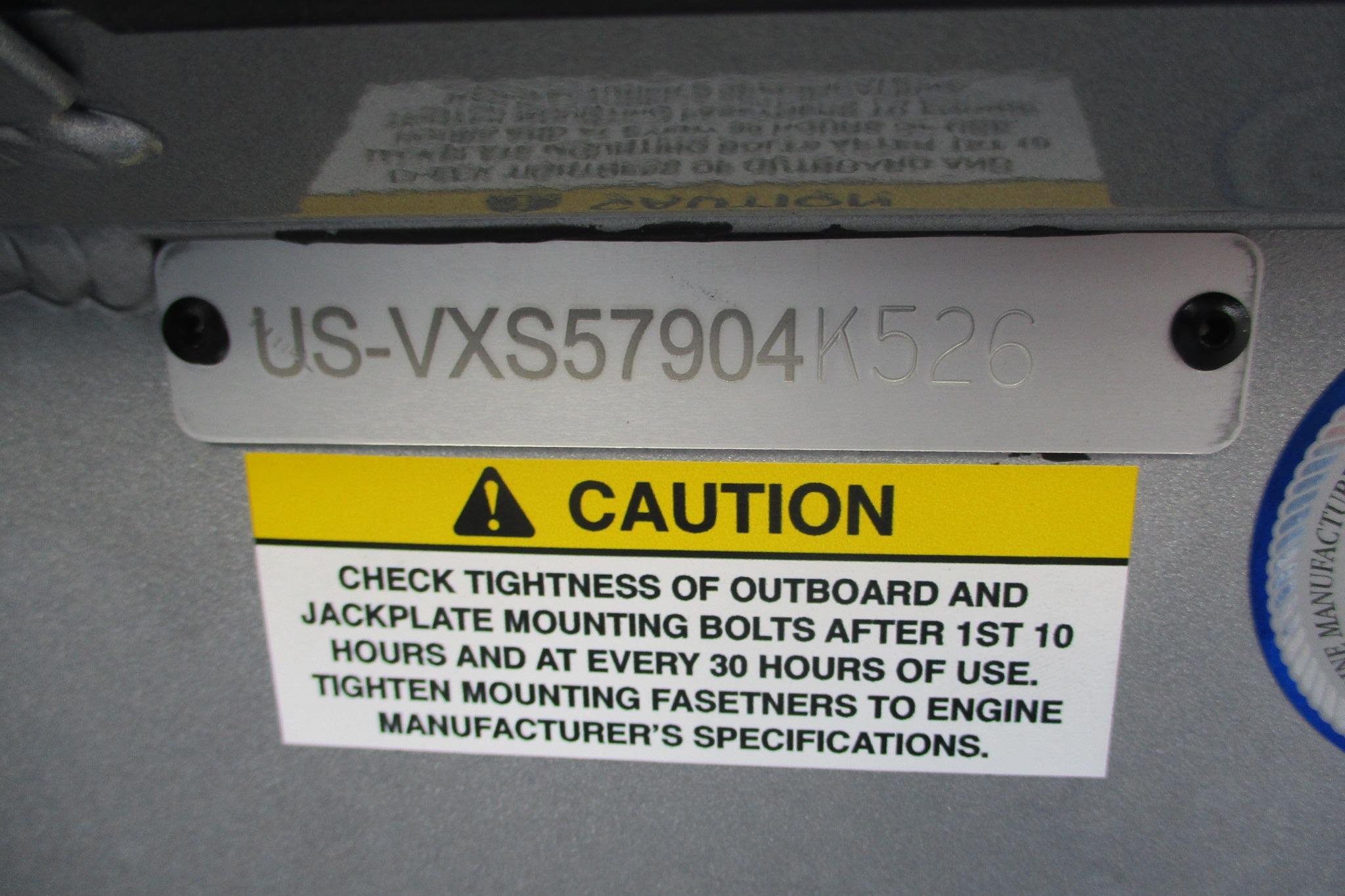 Hull identification number and caution label on 2026 Vexus AVX2080 boat.