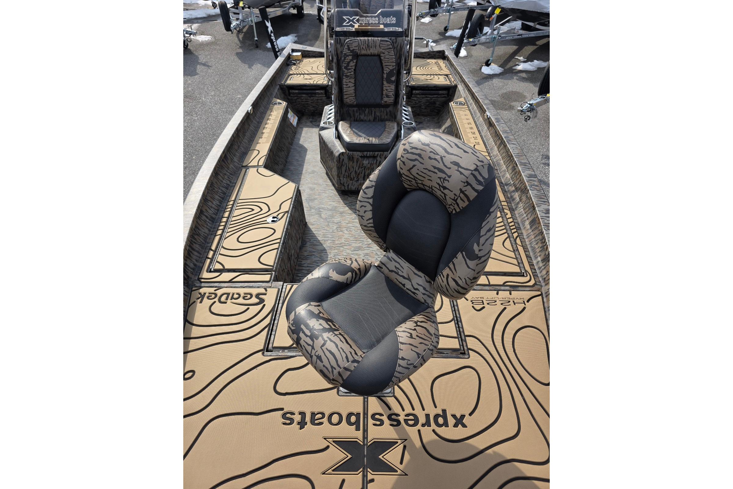 2026 Xpress H22B Bay boat interior with patterned seats and deck design.