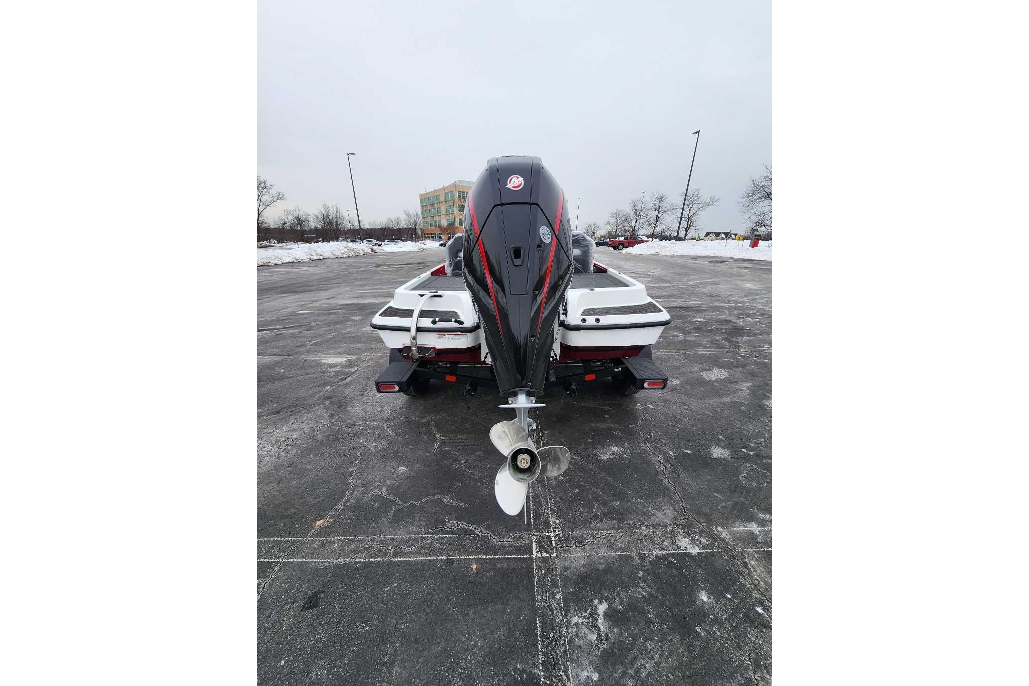 Rear view of 2026 Nitro Z19 XL Pro boat in snowy parking lot.