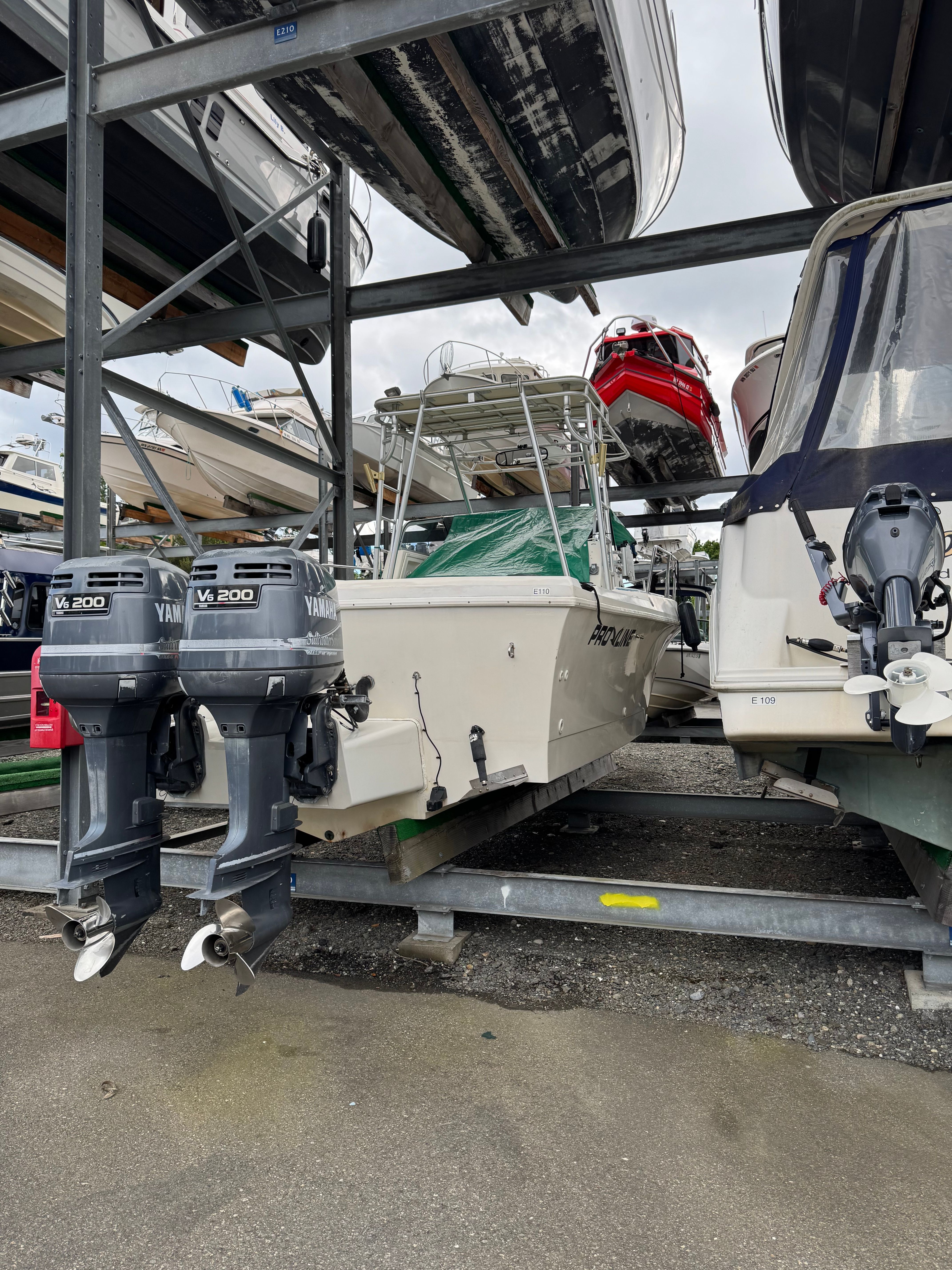 A 1991 Pro-Line Walkaround boat on a trailer with two outboard motors.
