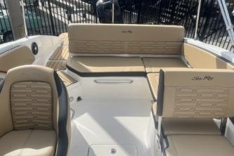 2017 Sea Ray SPX 210 Outboard boat interior with beige seating and sleek design.