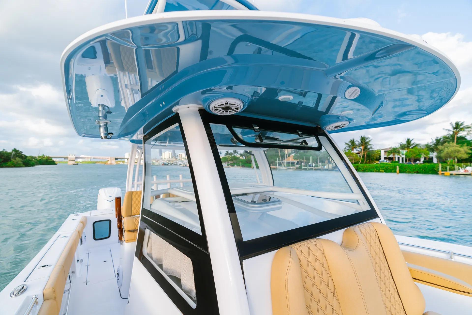 2026 Sportsman Open 352 Center Console boat on water, featuring sleek design and luxurious seating.