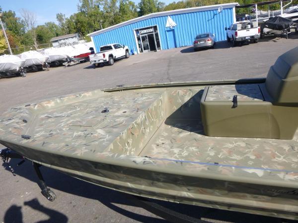 2024 Tracker Grizzly 1648 SC boat in a dealership parking lot.