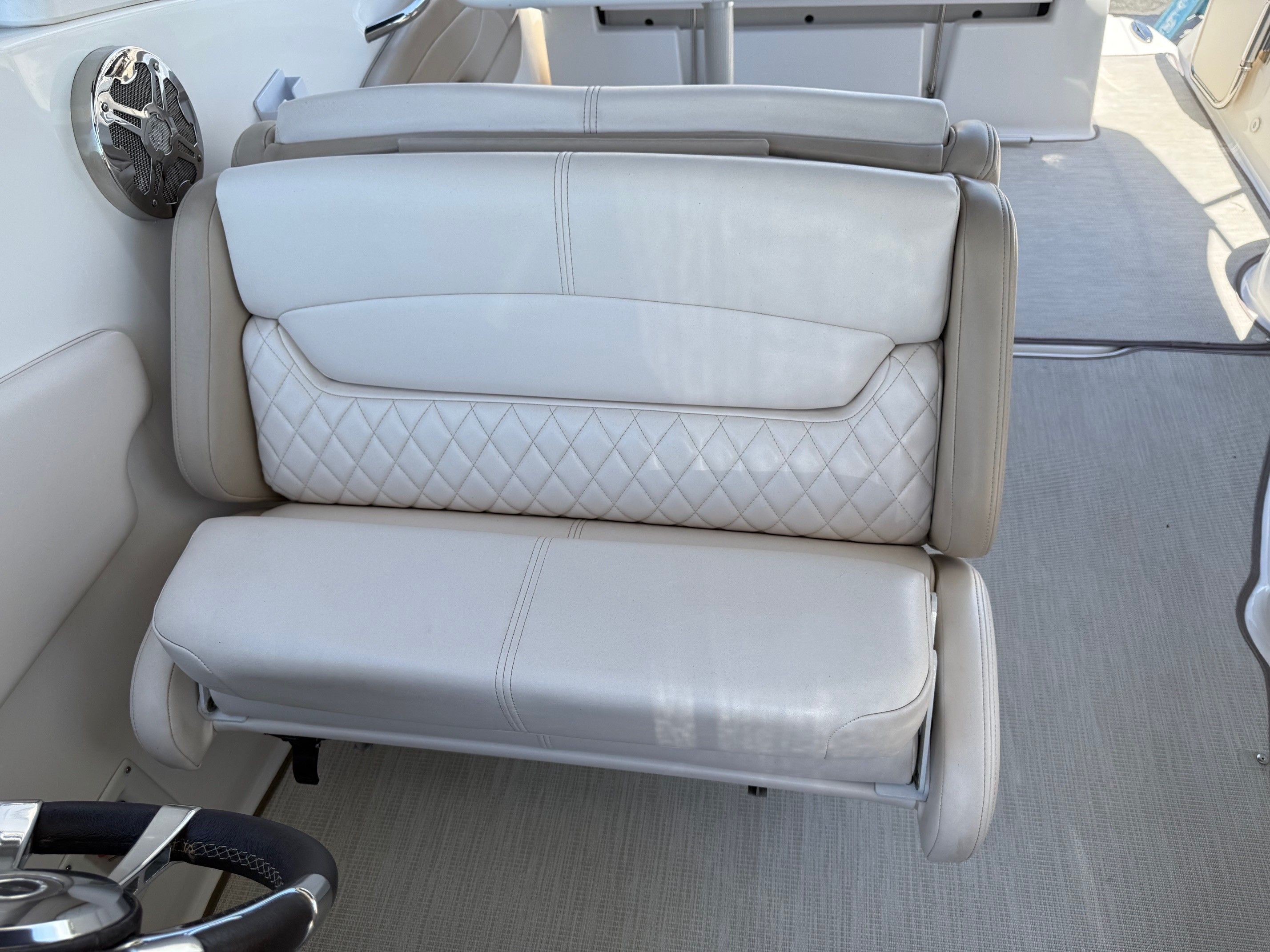 Interior of a 2018 Chaparral 270 Signature boat with white seating.