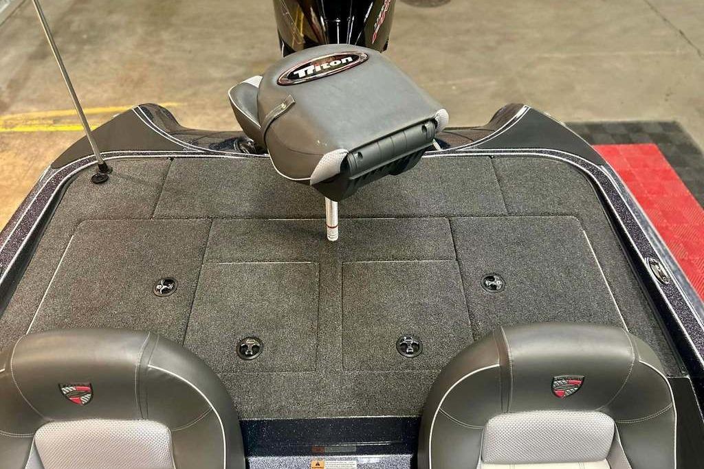 2026 Triton 18 TrX boat interior with cushioned seats and storage compartments.