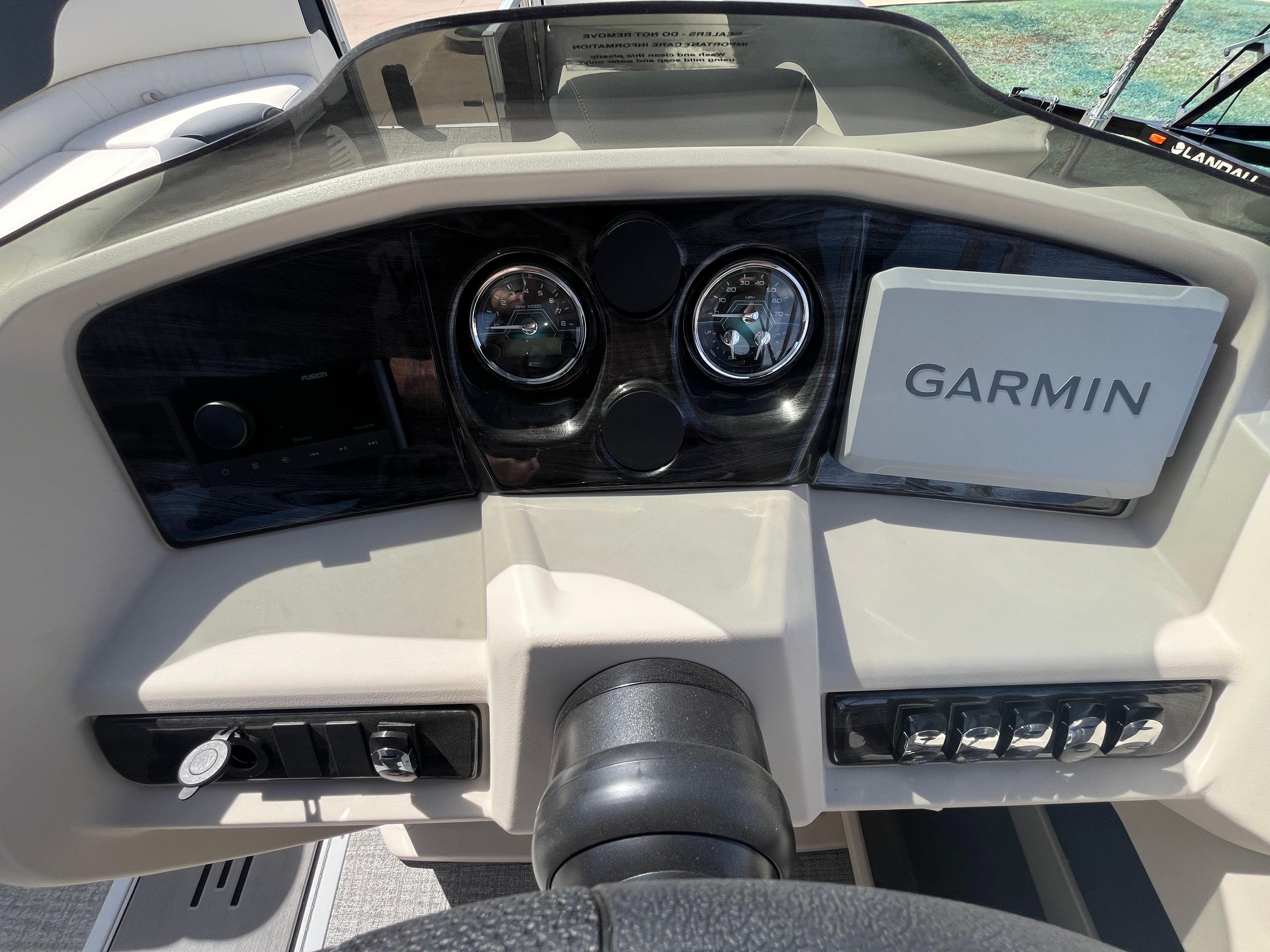 Dashboard of 2026 Tahoe 2385 LTZ Cruise with Garmin navigation.