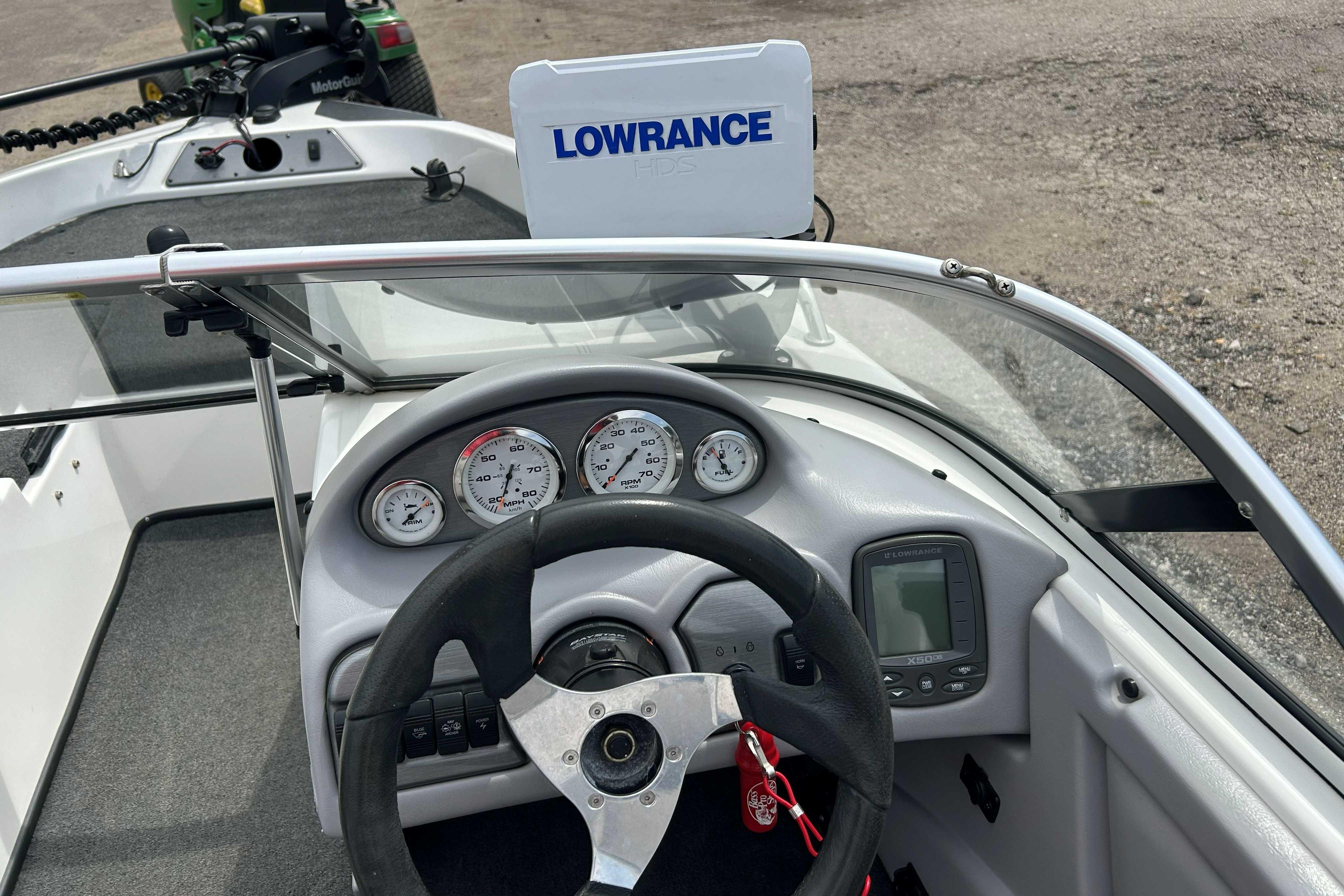 2010 Skeeter SL 180 boat dashboard with steering wheel, gauges, and Lowrance electronics.
