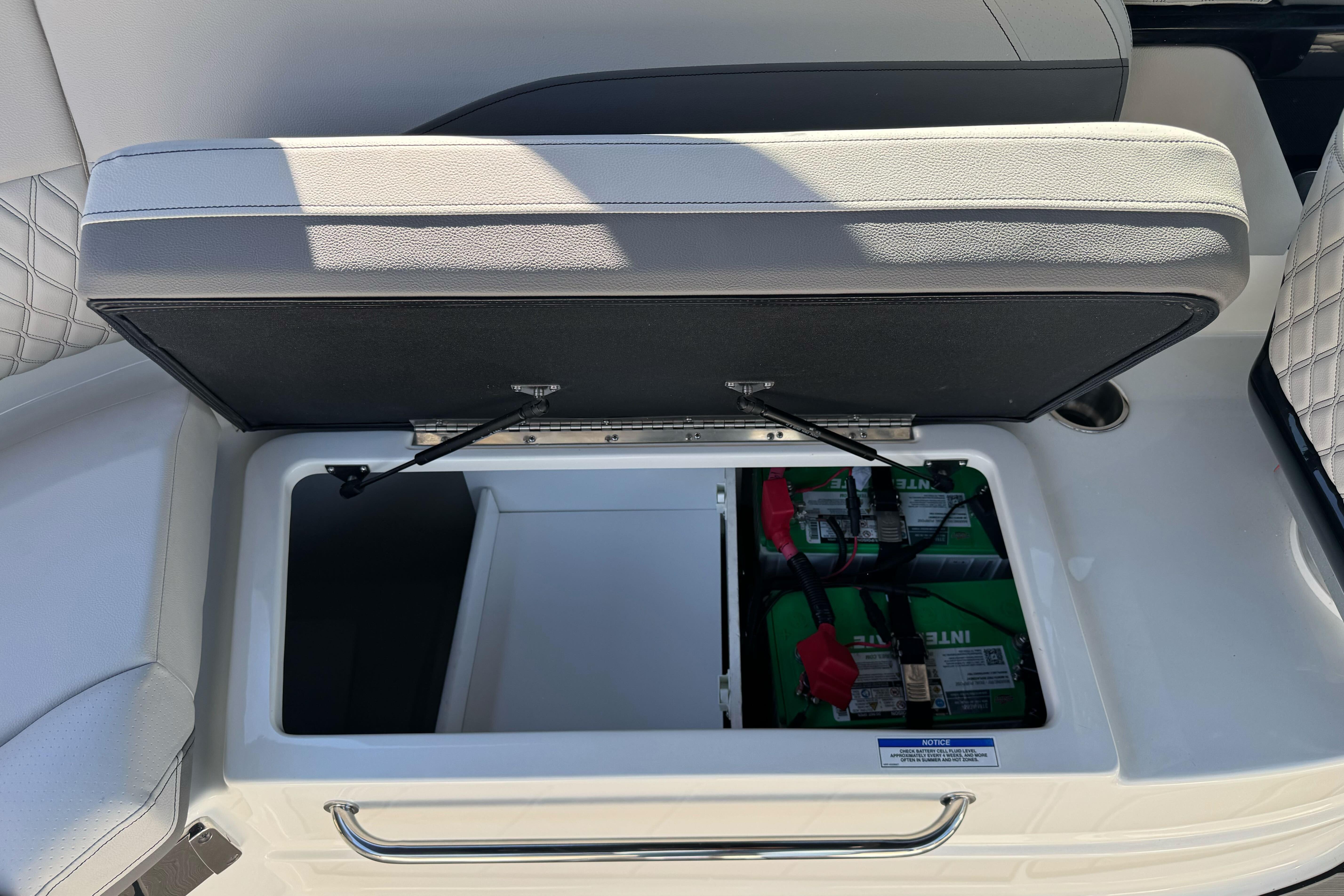 Storage compartment with batteries in 2026 Sea Ray SLX 260 boat.