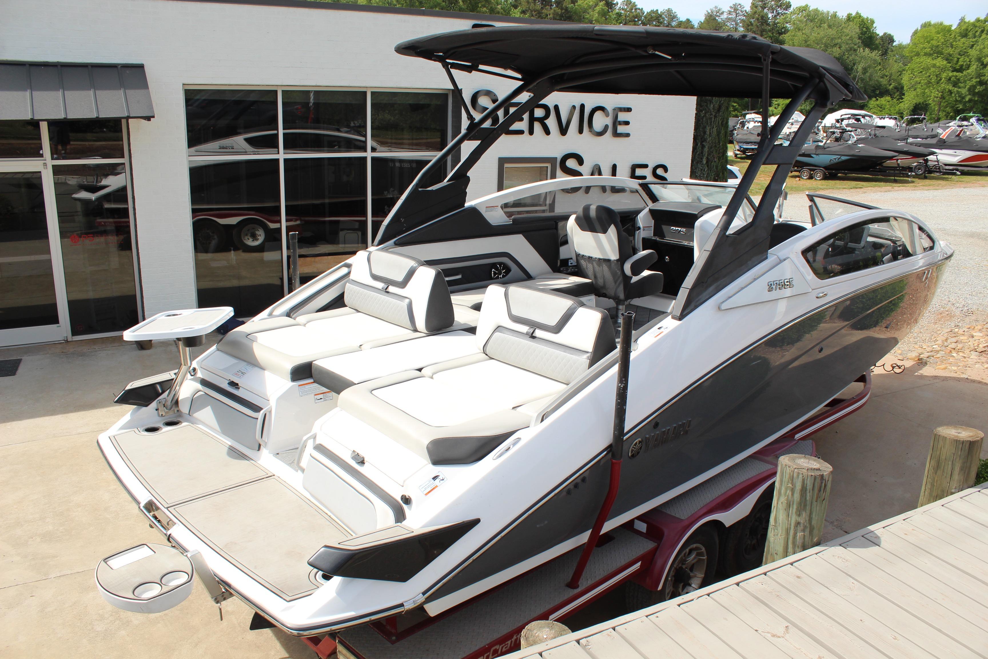 2020 Yamaha Boats 275SE on trailer, sleek design, white and gray exterior, at service and sales center.