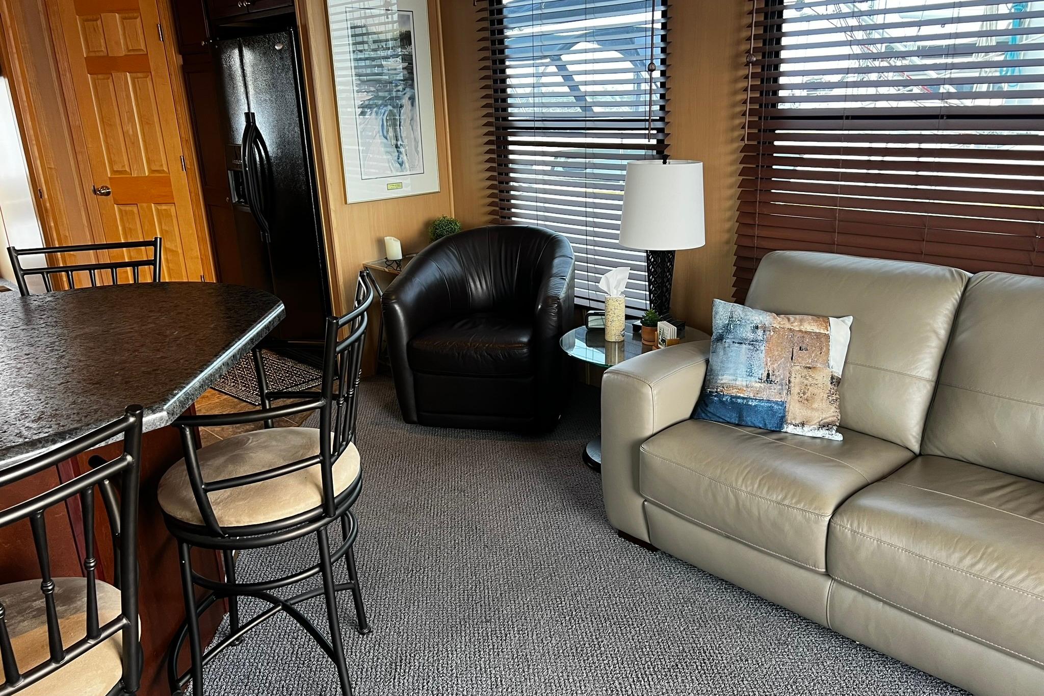 Interior of 2010 Skipperliner 480 Flybridge with modern seating and decor.