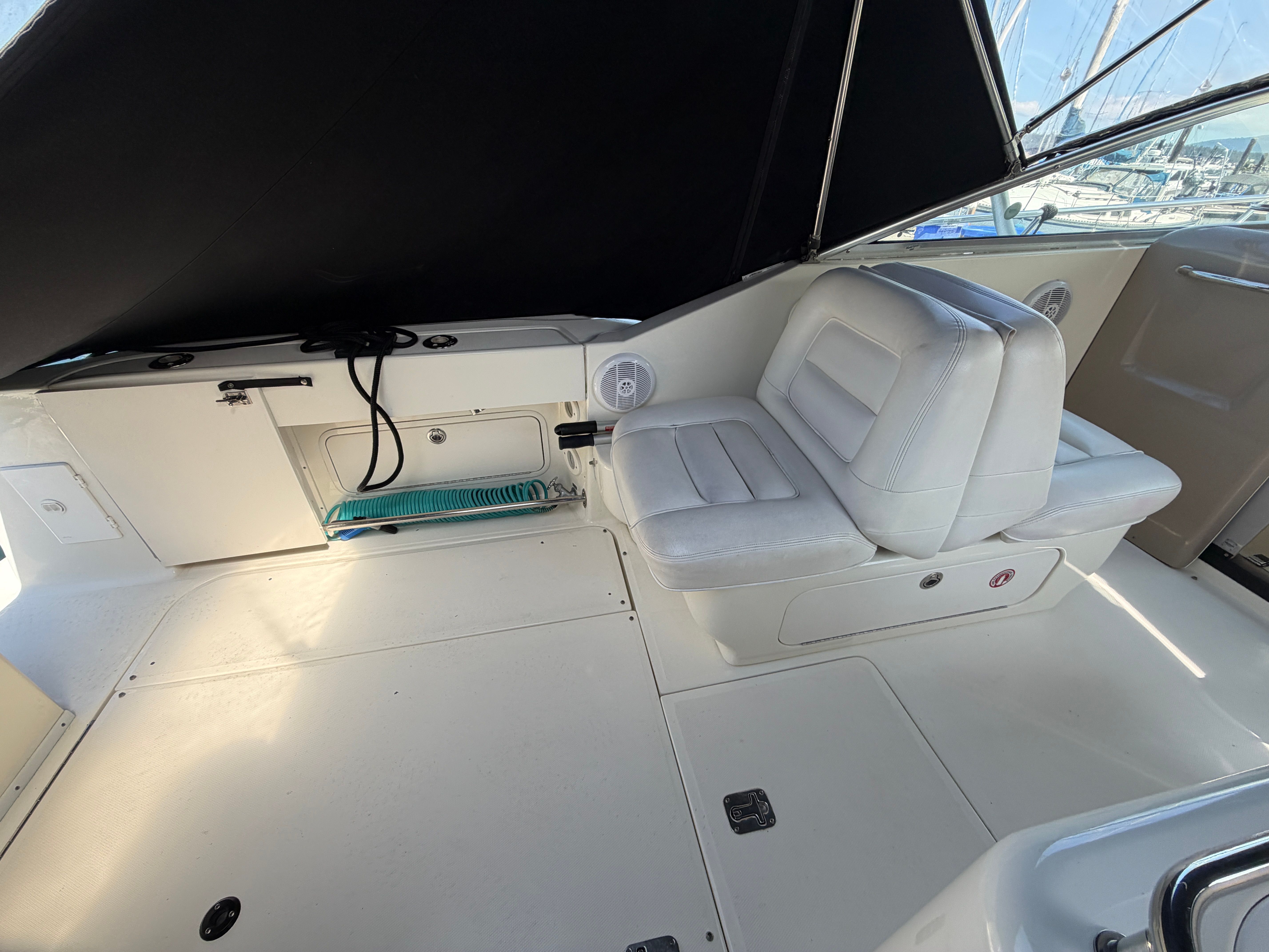 Interior of a 2005 Sea Ray 290 Amberjack with white seating.