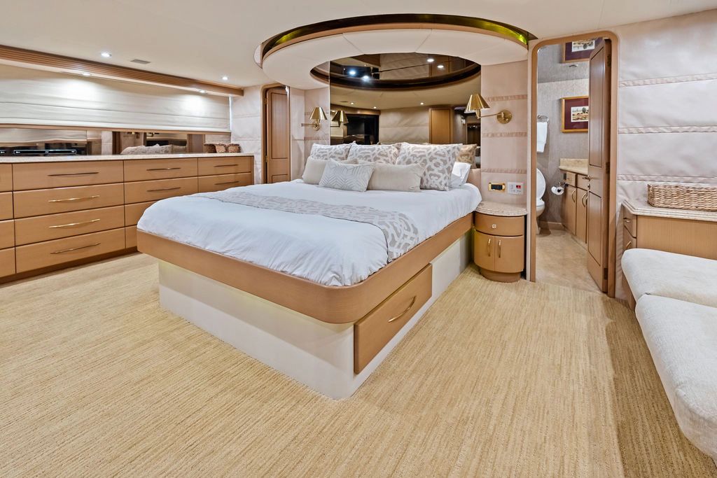 Luxurious bedroom on a 1999 Westport 112 yacht.