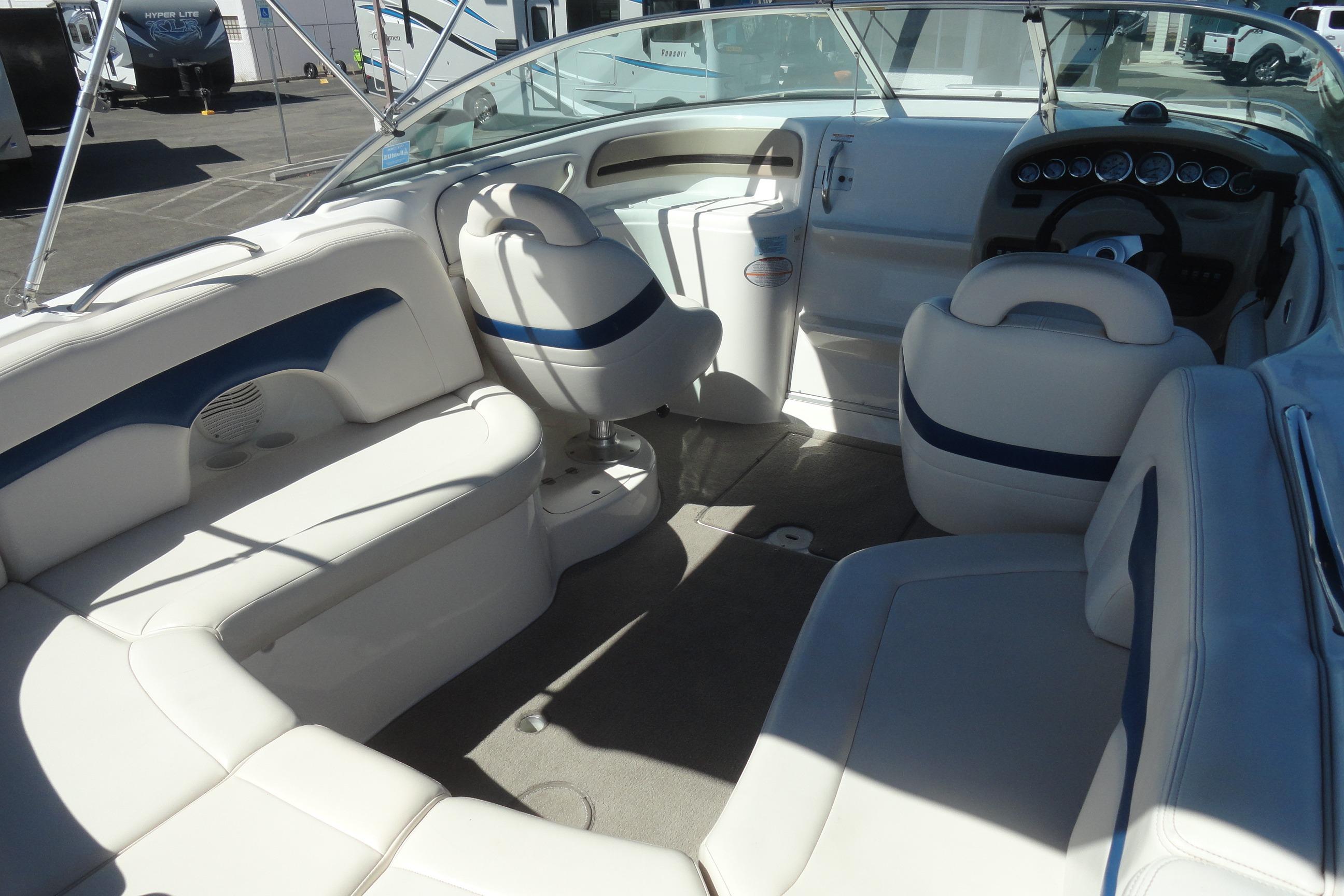 Interior of a 2001 Chaparral 265 SSi boat with white and blue seating.
