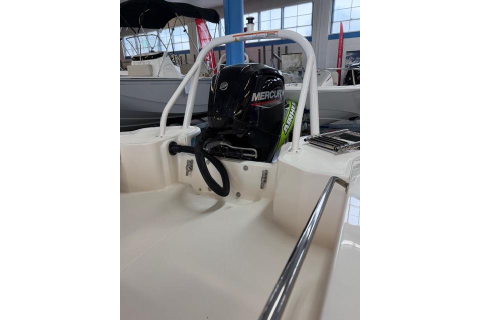 2026 Boston Whaler 160 Super Sport with Mercury engine in showroom.