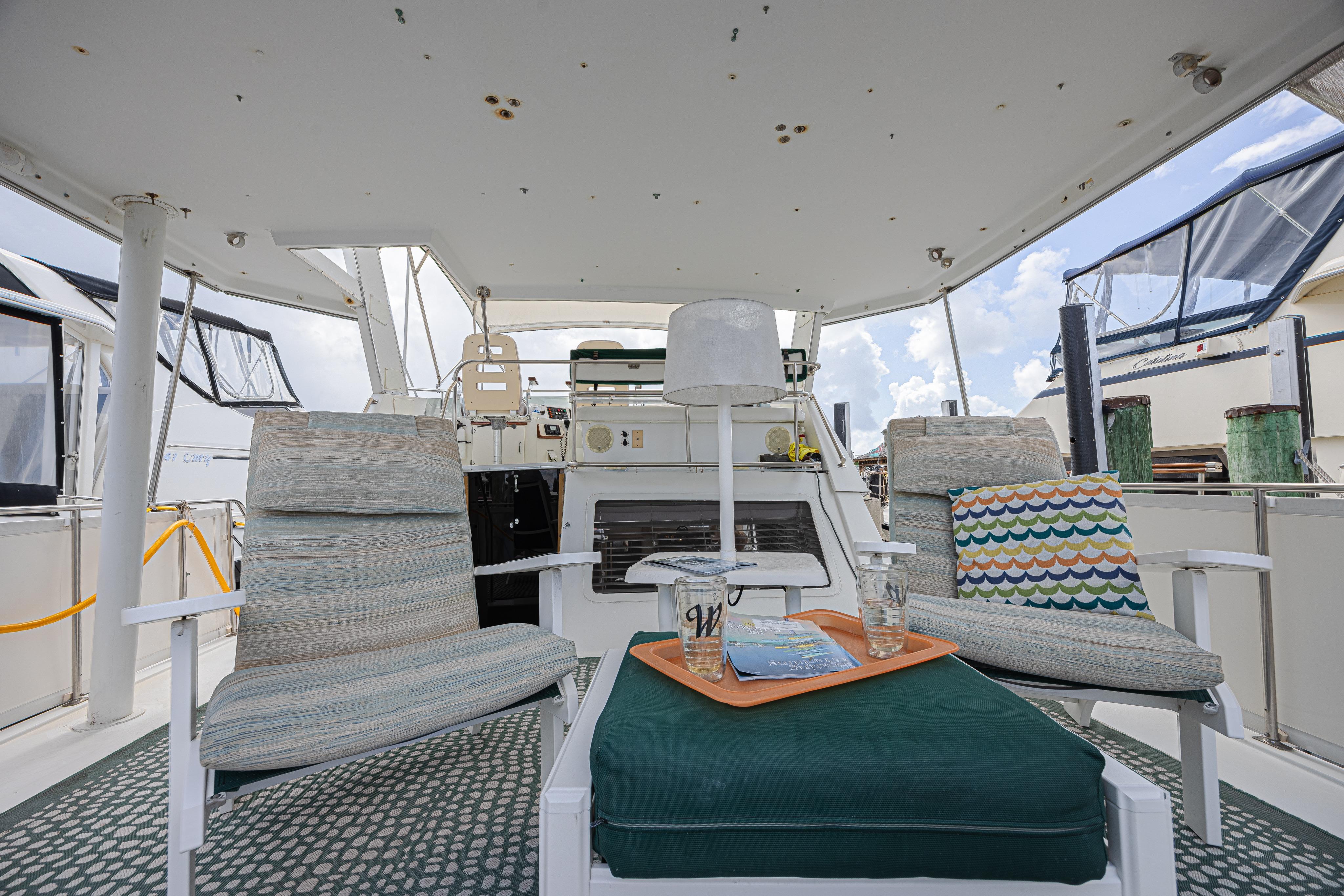 1994 Tollycraft 45 Cockpit Motor Yacht interior with cozy seating and nautical decor.