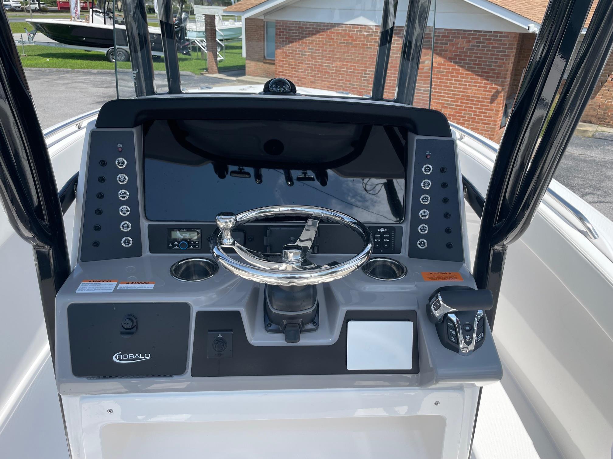 2025 Robalo R230 Center Console dashboard with steering wheel and control panel.