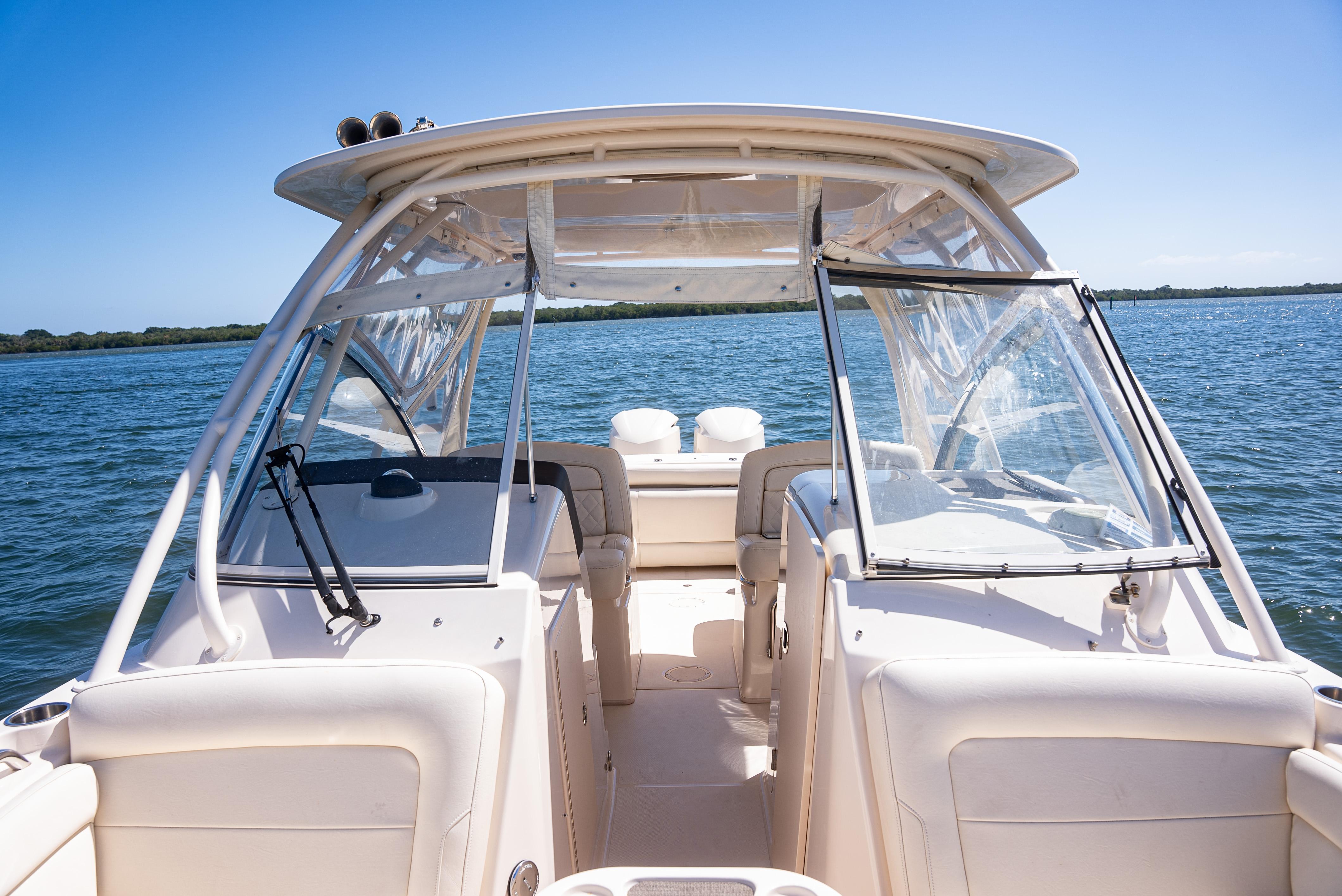 2020 Grady-White Freedom 285 boat on open water, showcasing cockpit and seating area.