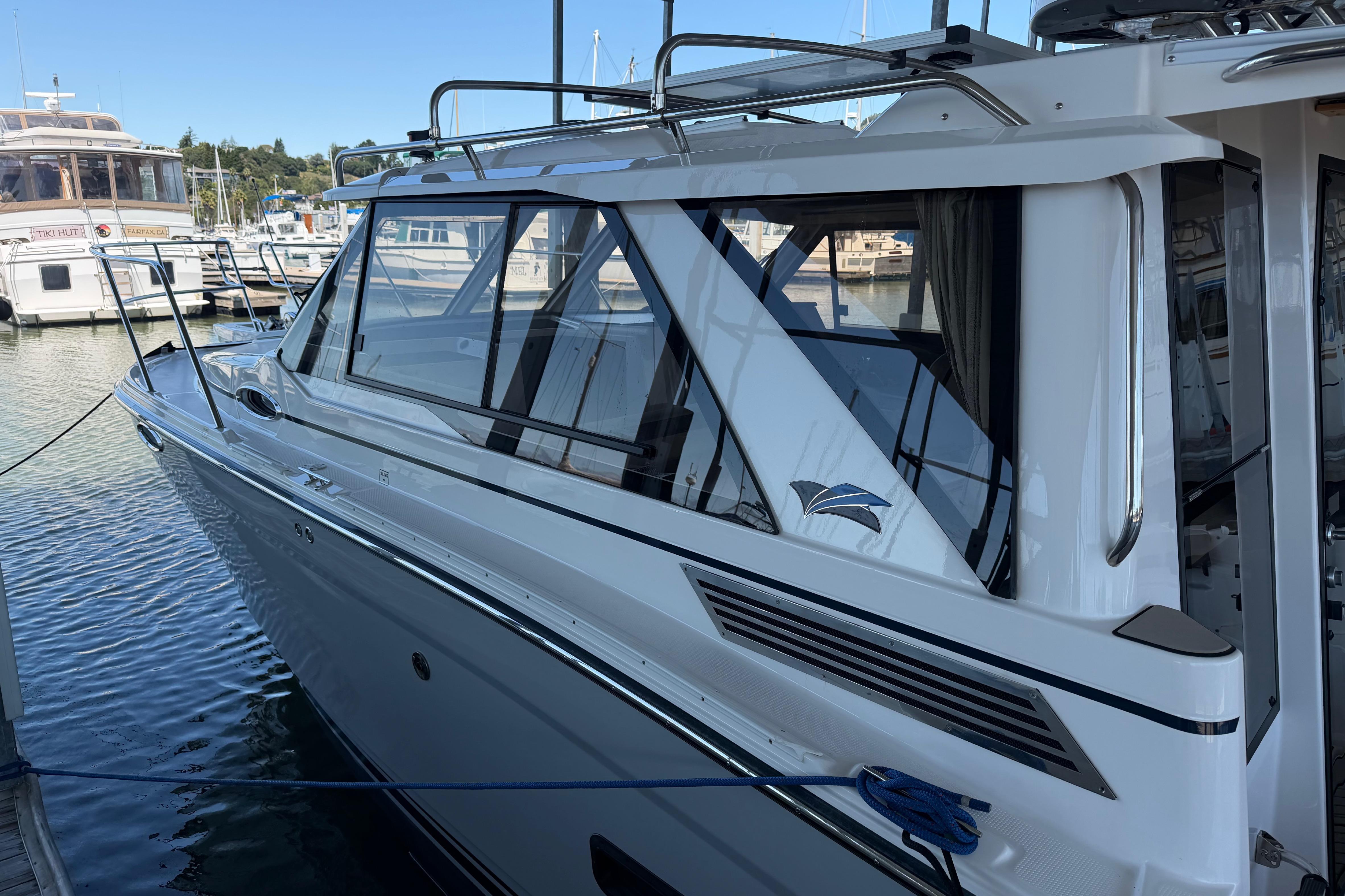 2023 Cutwater C-288 Coupe docked at a marina, showcasing sleek design and modern features.