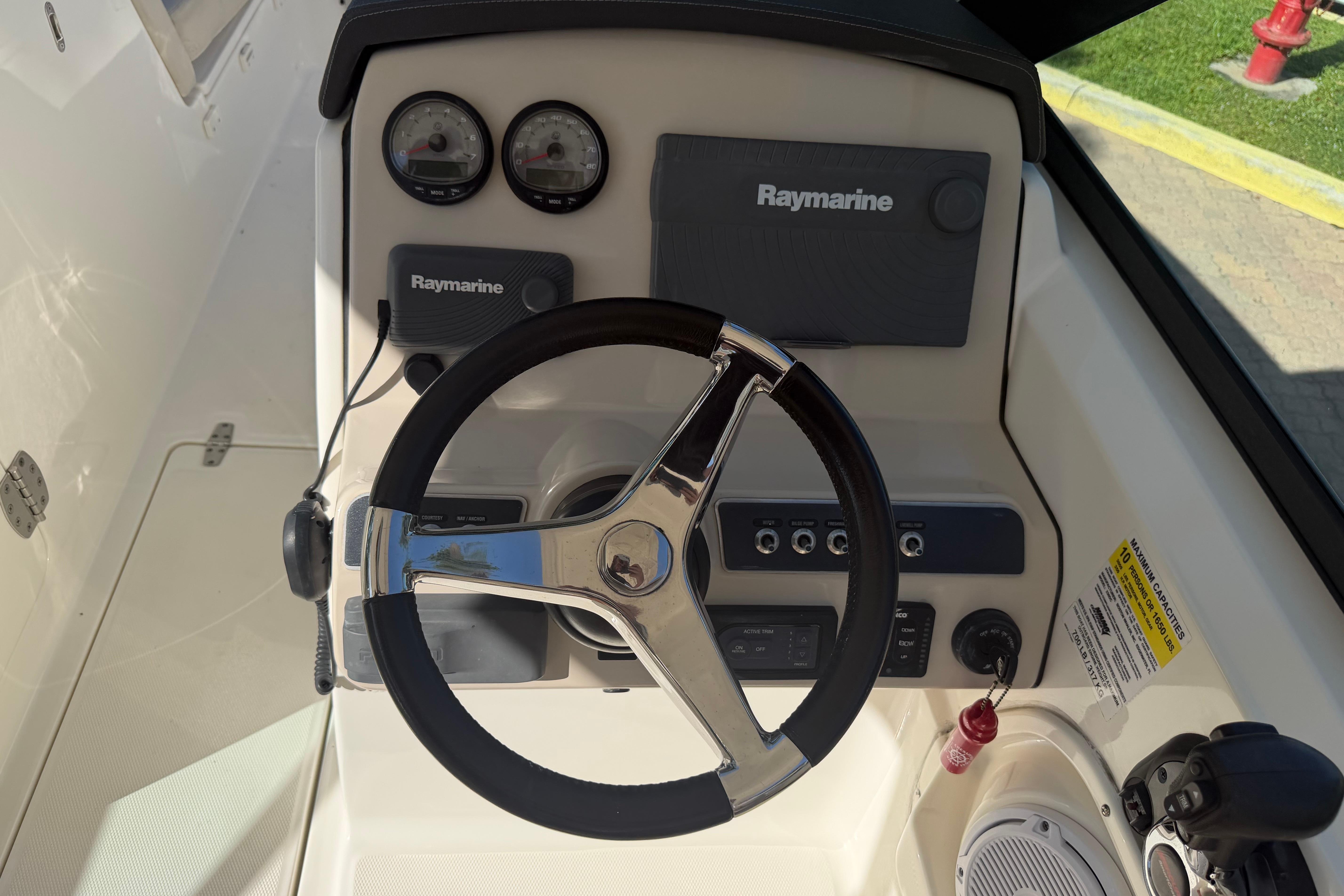 Steering console of 2016 Boston Whaler 230 Vantage with Raymarine electronics.