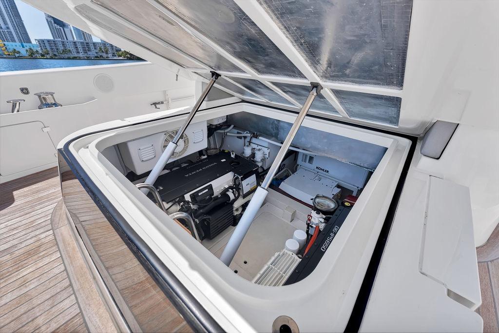 Engine compartment of 2021 Bluegame BG 42 yacht, showcasing mechanical components and equipment.