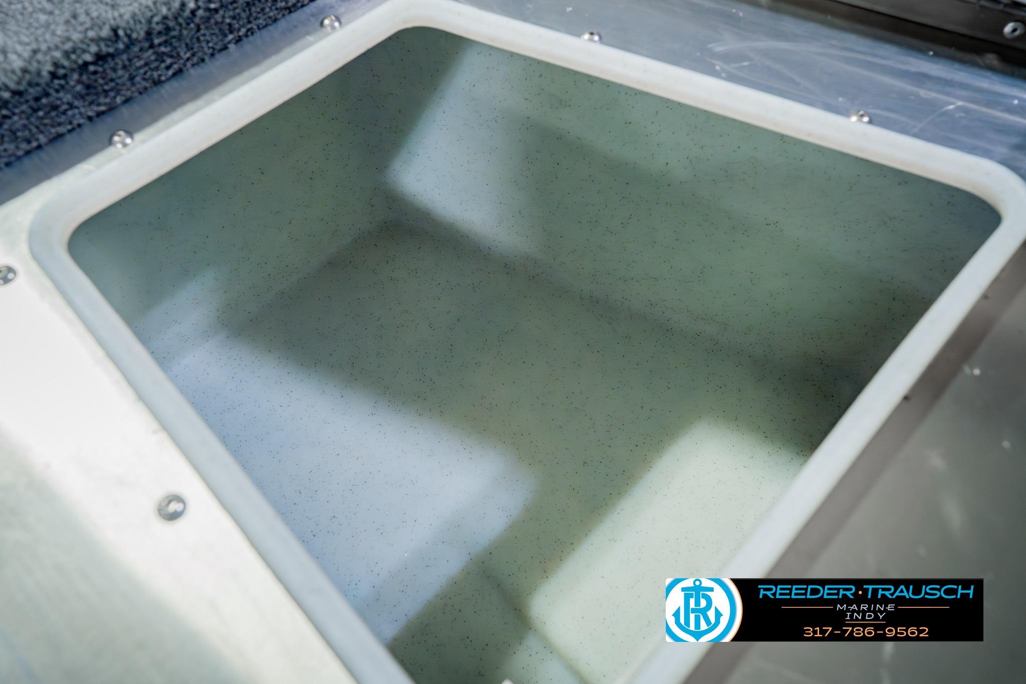 2026 Lund 1875 Impact XS boat storage compartment, featuring spacious interior design.