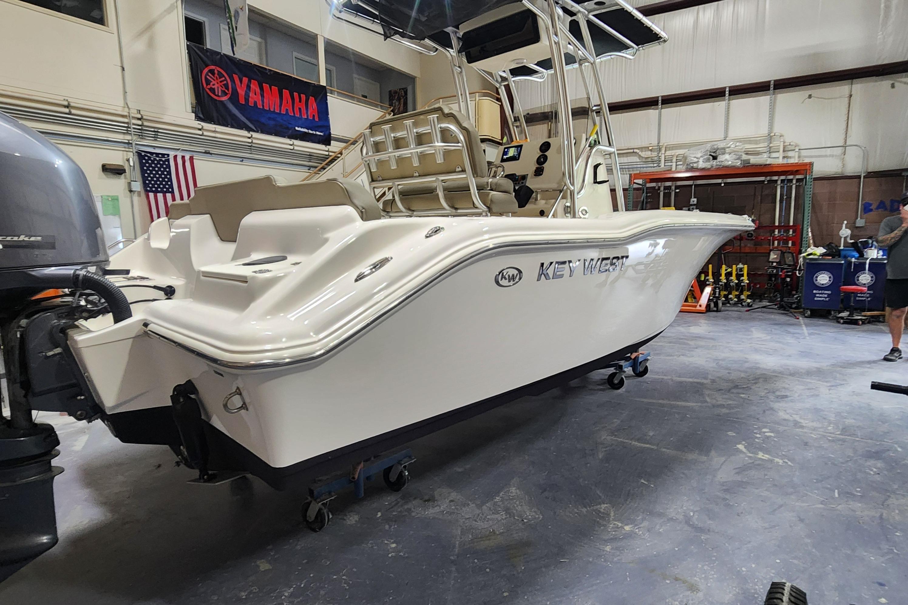 2023 Key West 219 FS boat in a workshop, featuring Yamaha equipment.