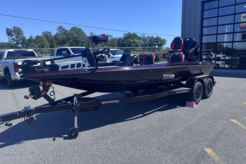 2026 Phoenix 819 ZXL boat on trailer, parked outdoors near vehicles.