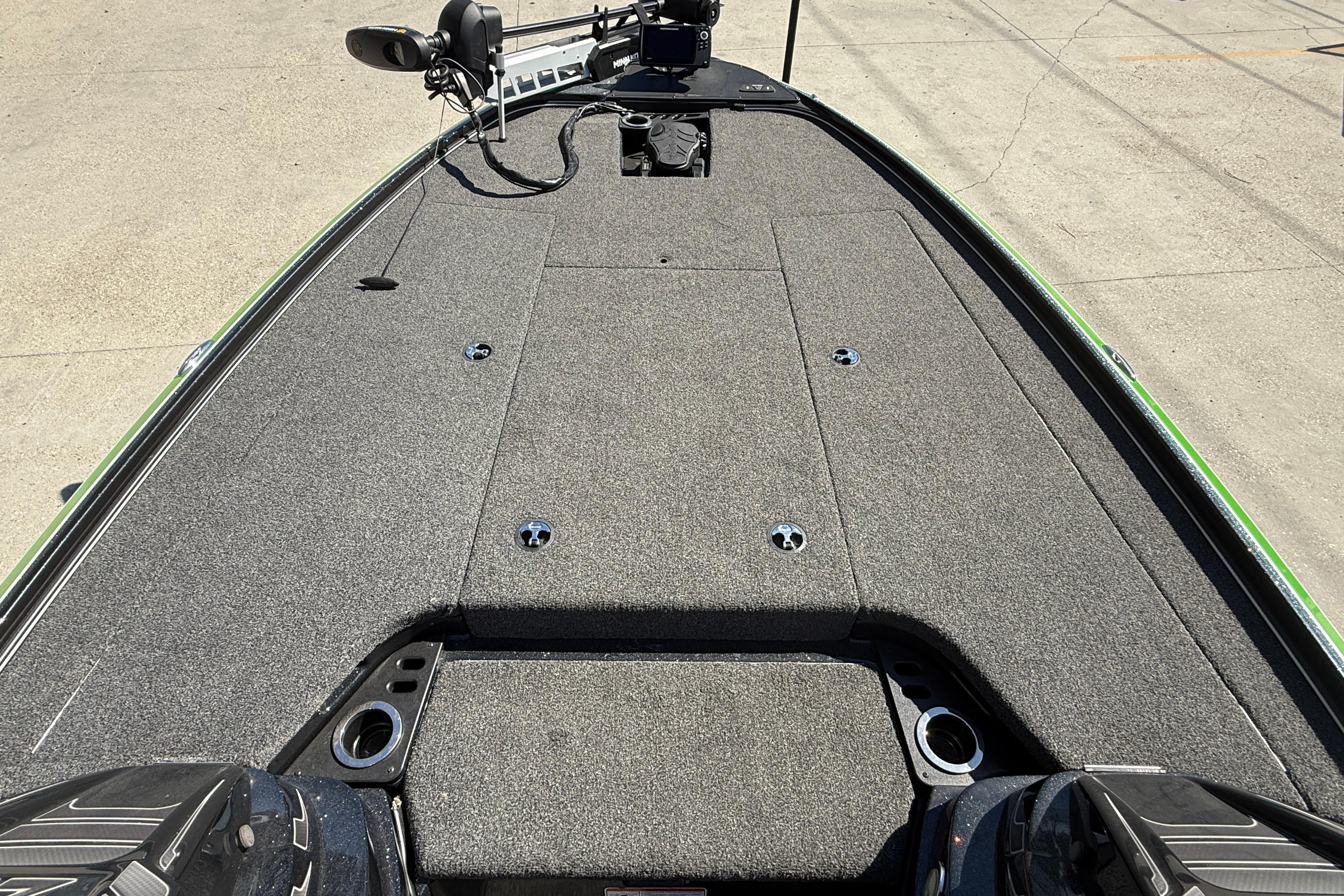 2020 Nitro Z20 boat deck with carpeted surface and fishing equipment.